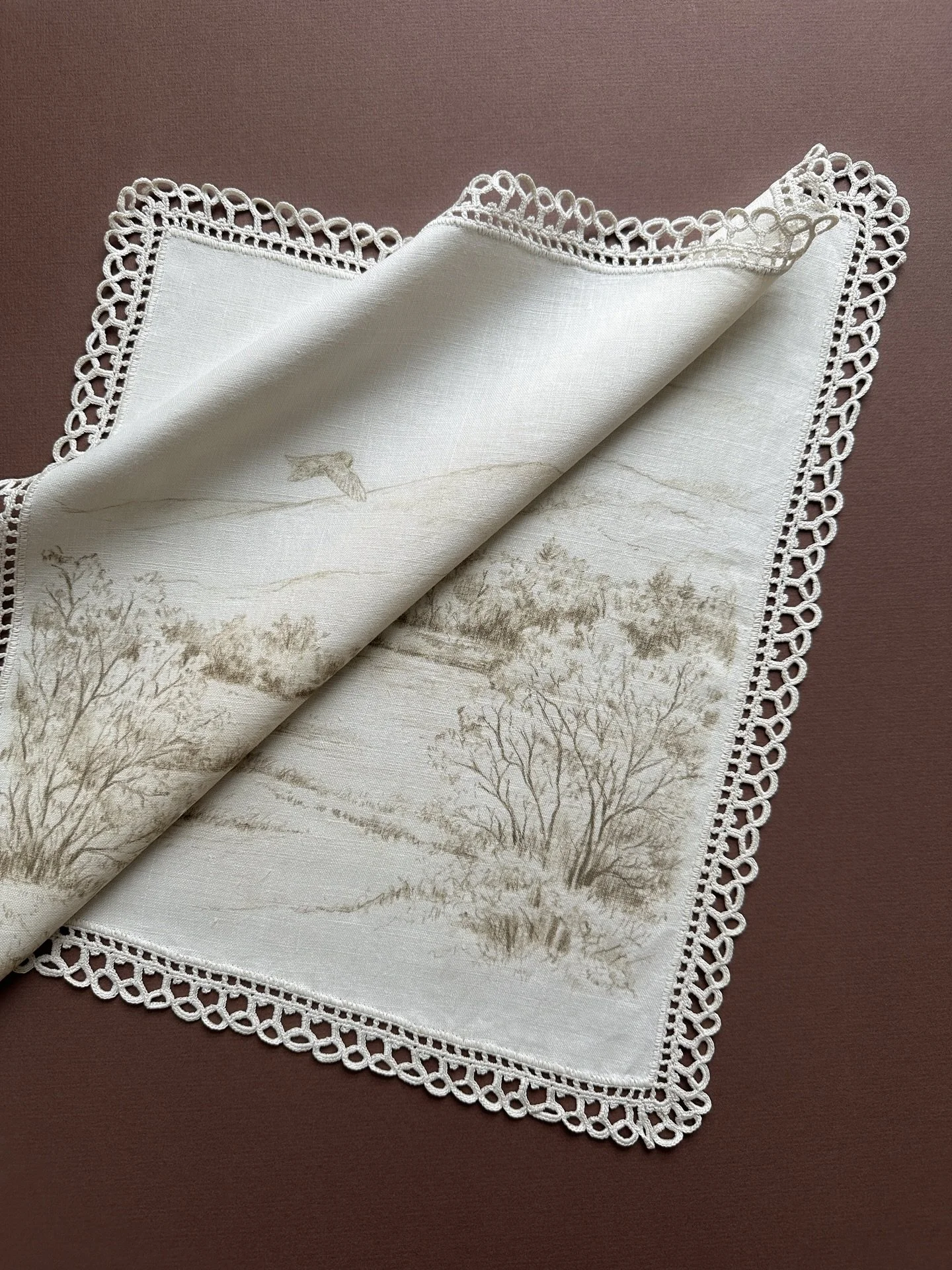 I love giving these vintage linens another life. This one came home with me from a flea market in Italy, softened by years of use. Its embroidery feels light and hopeful against a quiet New Hampshire hillside, with an owl sweeping gently through the 