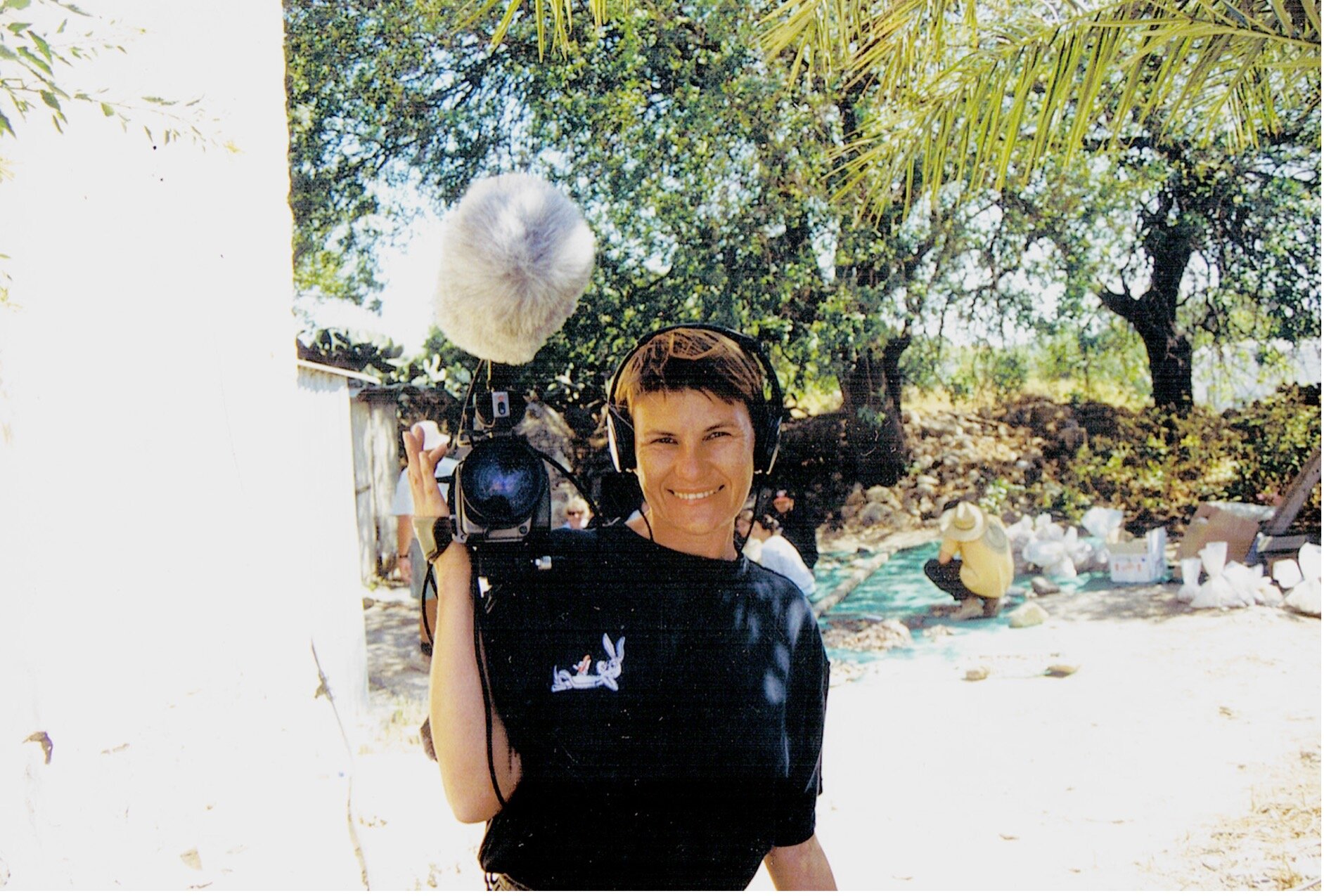  Artist  Amanda Dusting  on site with video camera in the early days of the project. Dusting has documented both the archaeological and anthropological processes of the excavation through the media of digital videoing over many years of her participa