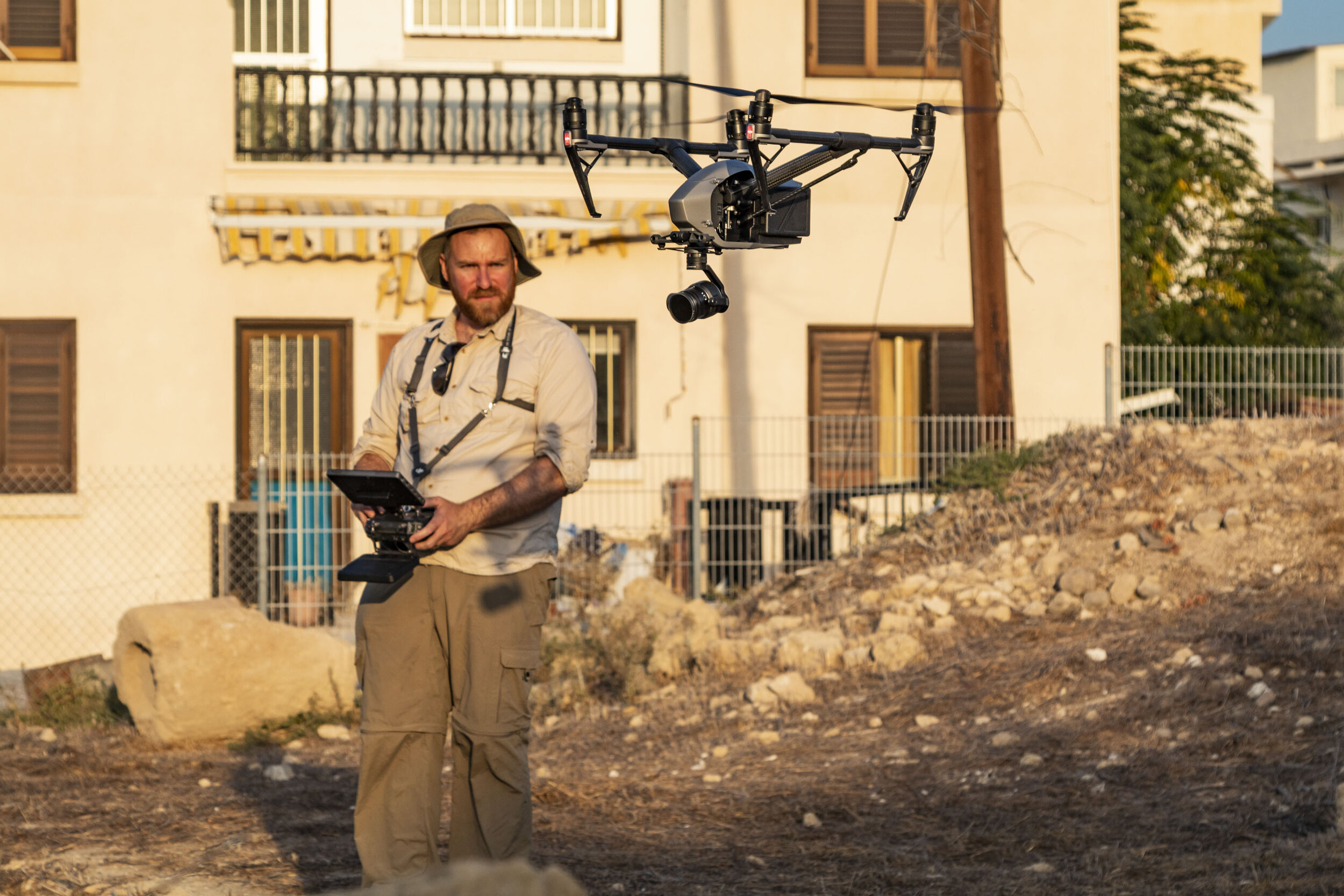  Visual artist  Rowan Conroy  flying a drone over the site in 2019 to make video work. Conroy’s practice focuses on photography, rephotography, and archaeology. Photo: Bob Miller. 