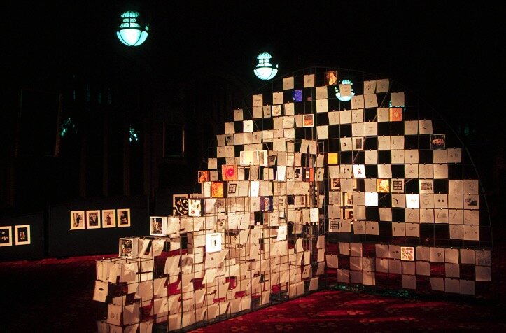  Installation view of the exhibition  Out of Oblivion,  1998. The gridded metal structure, based on the proportions of theatre architecture, held hundreds of transparent archaeological drawings and small artworks, lit to effect by theatre technician 