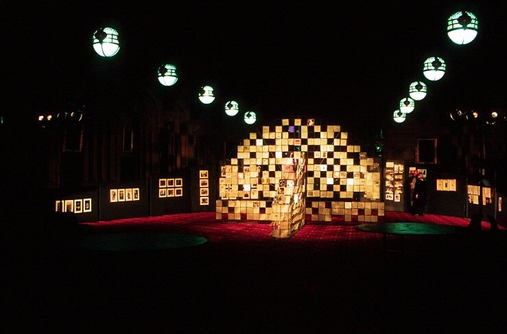  Installation view of the exhibition  Out of Oblivion,  1998. The gridded metal structure, based on the proportions of theatre architecture, held hundreds of transparent archaeological drawings and small artworks, lit to effect by theatre technician 