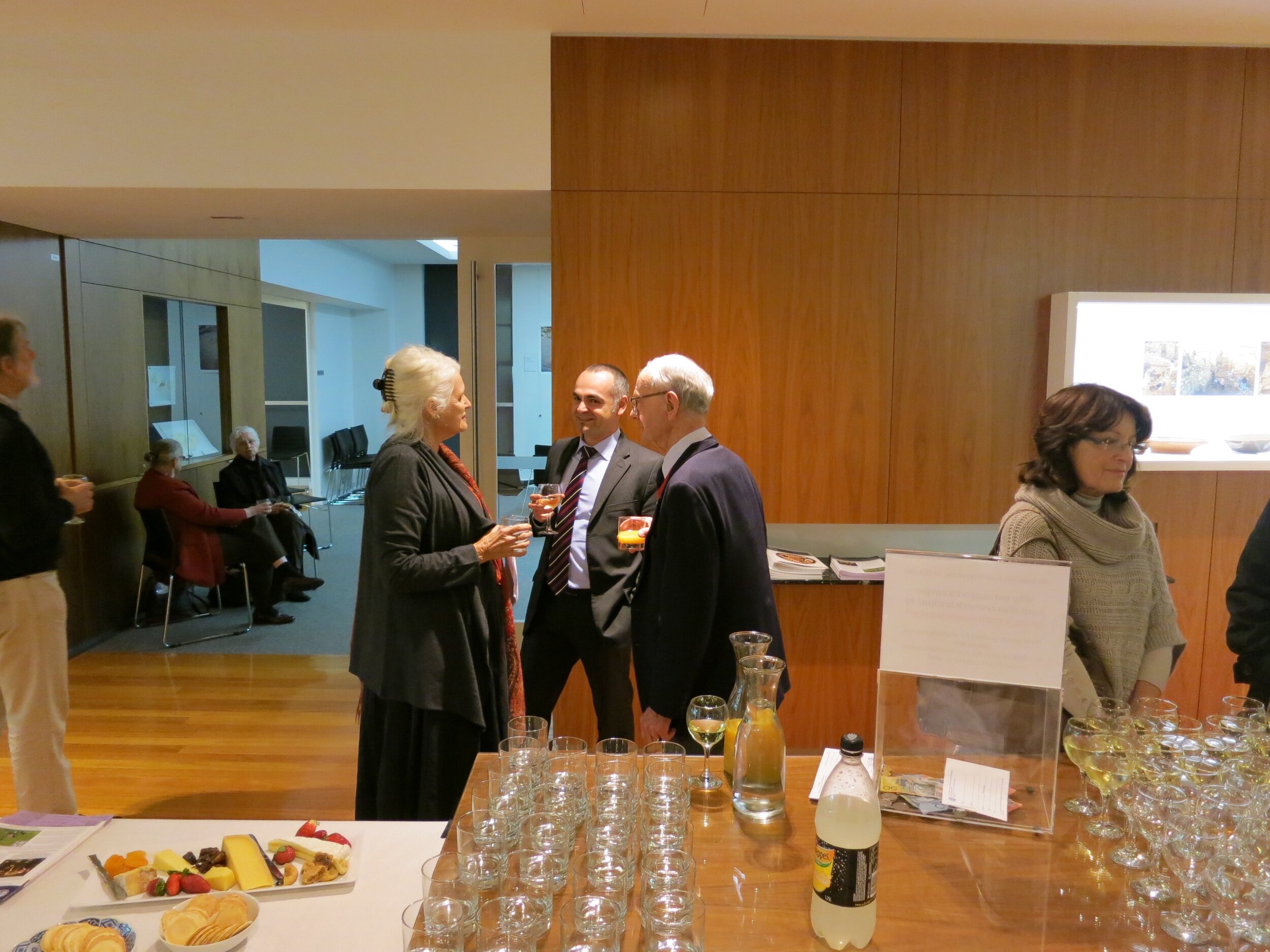  From left: Prof. Diana Wood Conroy; Andreas Hadjithemistos, Consul of the High Commission of Cyprus in Canberra; and the late Prof. Alexander Cambitoglou together at the opening of  Response to Cyprus,  10 July 2013. The event was hosted by the Aust