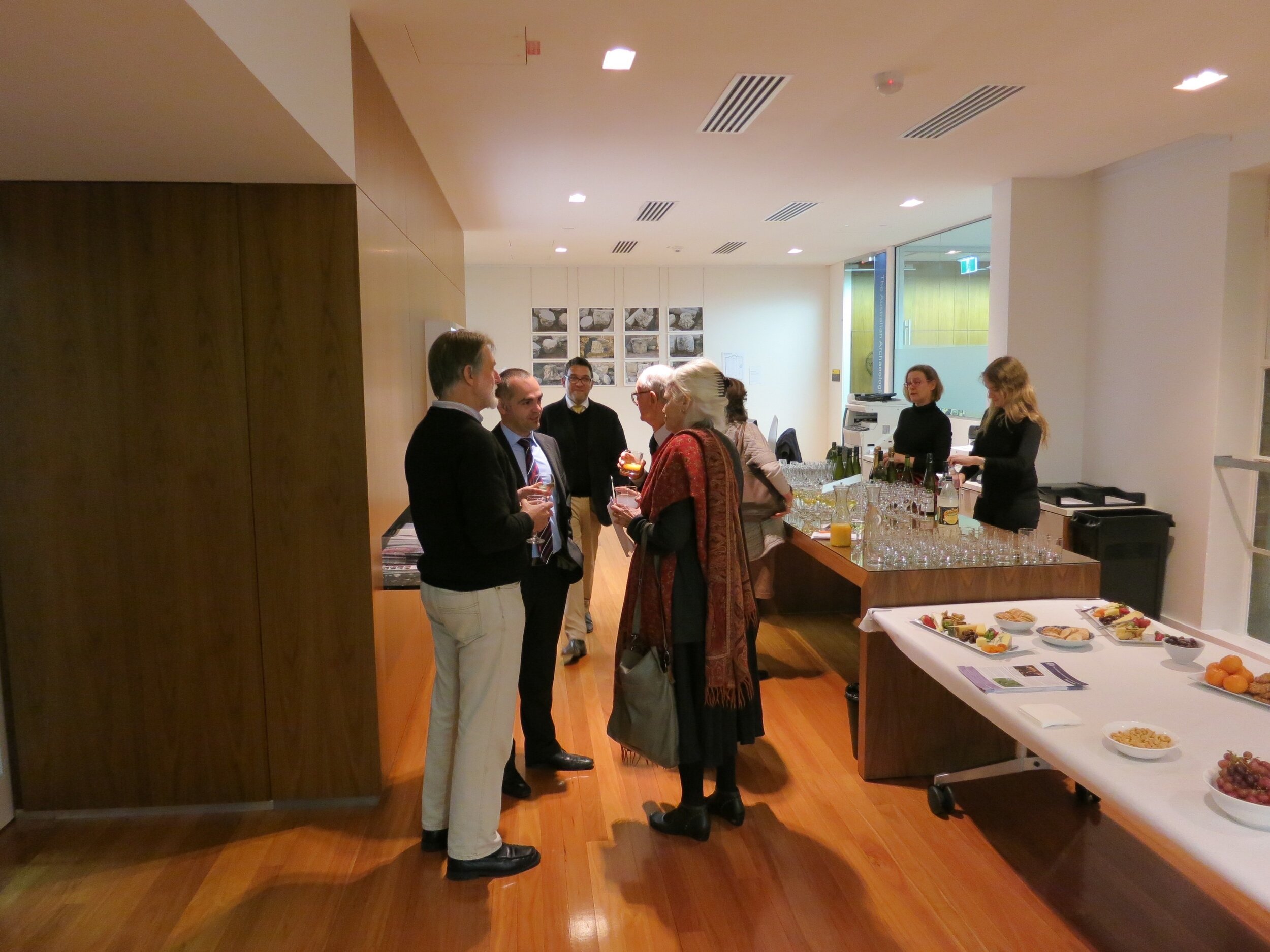  View of the opening of  Response to Cyprus,  10 July 2013, hosted by the Australian Archaeological Institute at Athens (AAIA) at the Centre of Classical and Near Eastern Studies of Australia (CCANESA). Work by  Derek Kreckler  is shown on the rear w