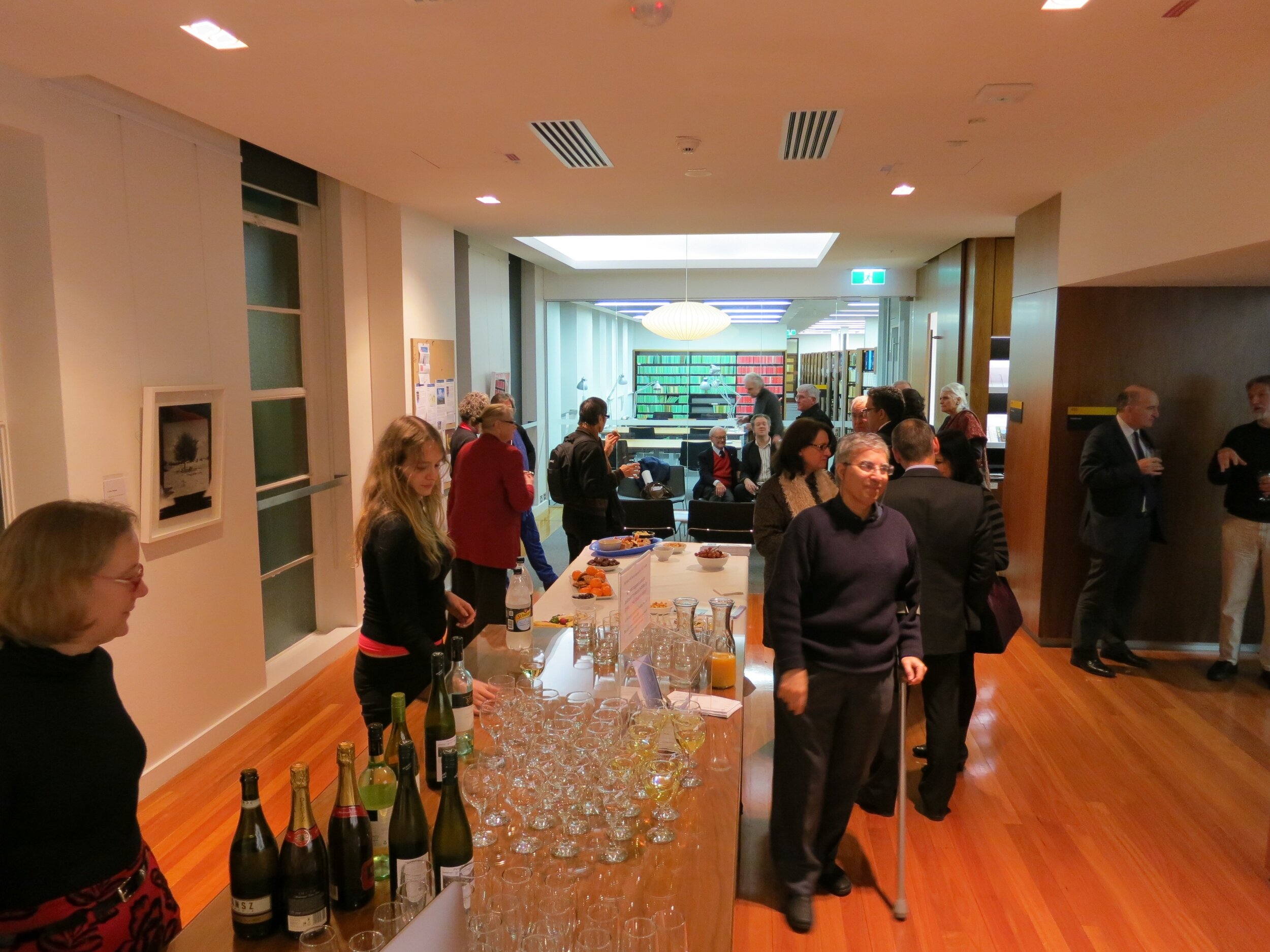  View of the opening of  Response to Cyprus,  10 July 2013, hosted by the Australian Archaeological Institute at Athens (AAIA) at the Centre of Classical and Near Eastern Studies of Australia (CCANESA). Work by  Jacky Redgate  shown on the left wall.