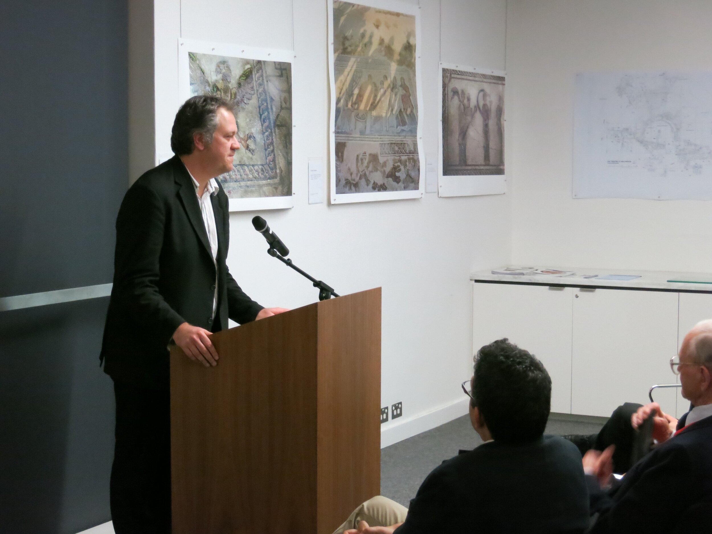  Dr. Craig Barker speaking at the opening of  Response to Cyprus,  10 July 2013, hosted by the Australian Archaeological Institute at Athens (AAIA) at the Centre of Classical and Near Eastern Studies of Australia (CCANESA). Works by Derek Kreckler ar