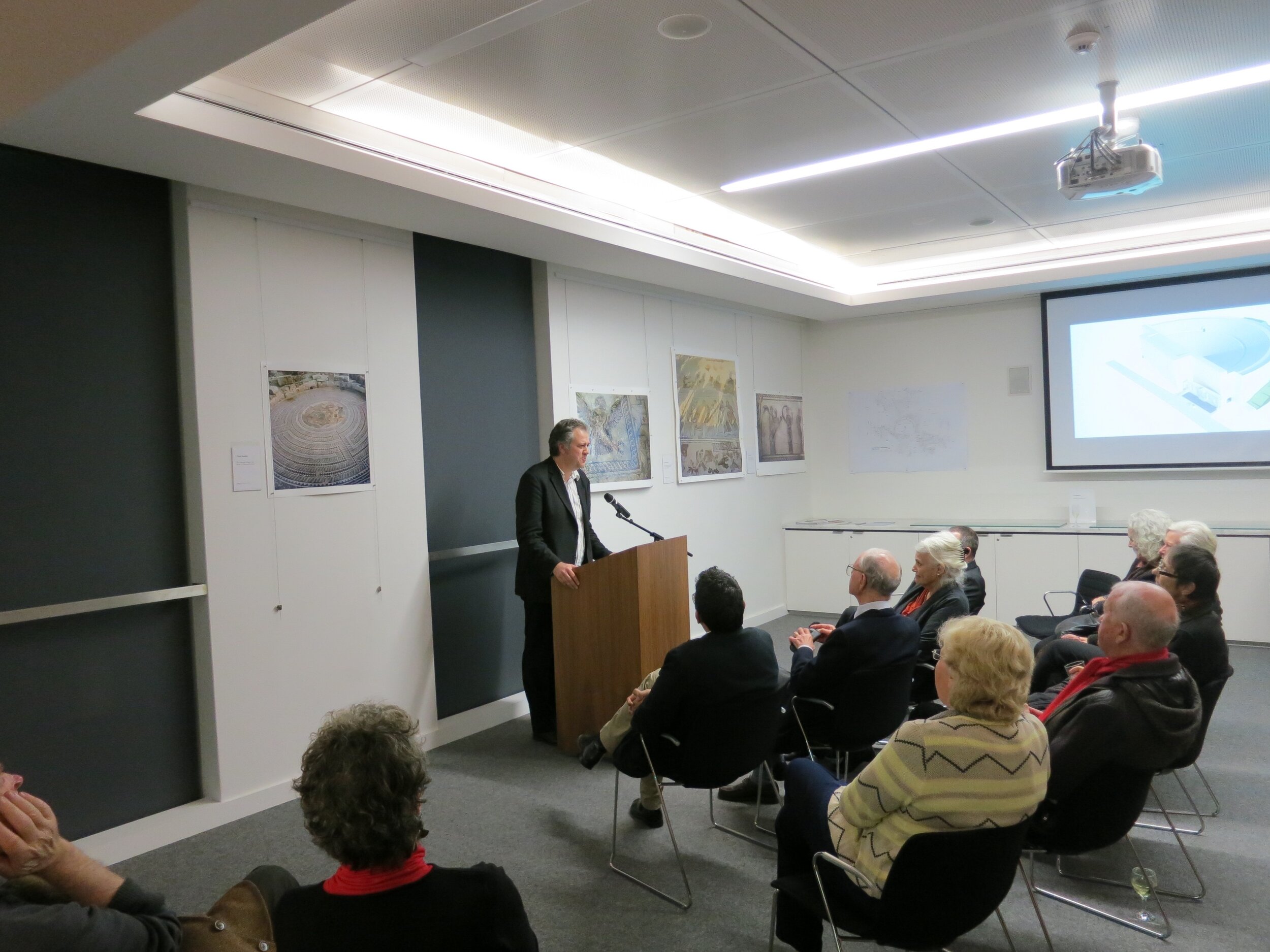  Dr. Craig Barker speaking at the opening of  Response to Cyprus,  10 July 2013, hosted by the Australian Archaeological Institute at Athens (AAIA) at the Centre of Classical and Near Eastern Studies of Australia (CCANESA). Works by Derek Kreckler ar