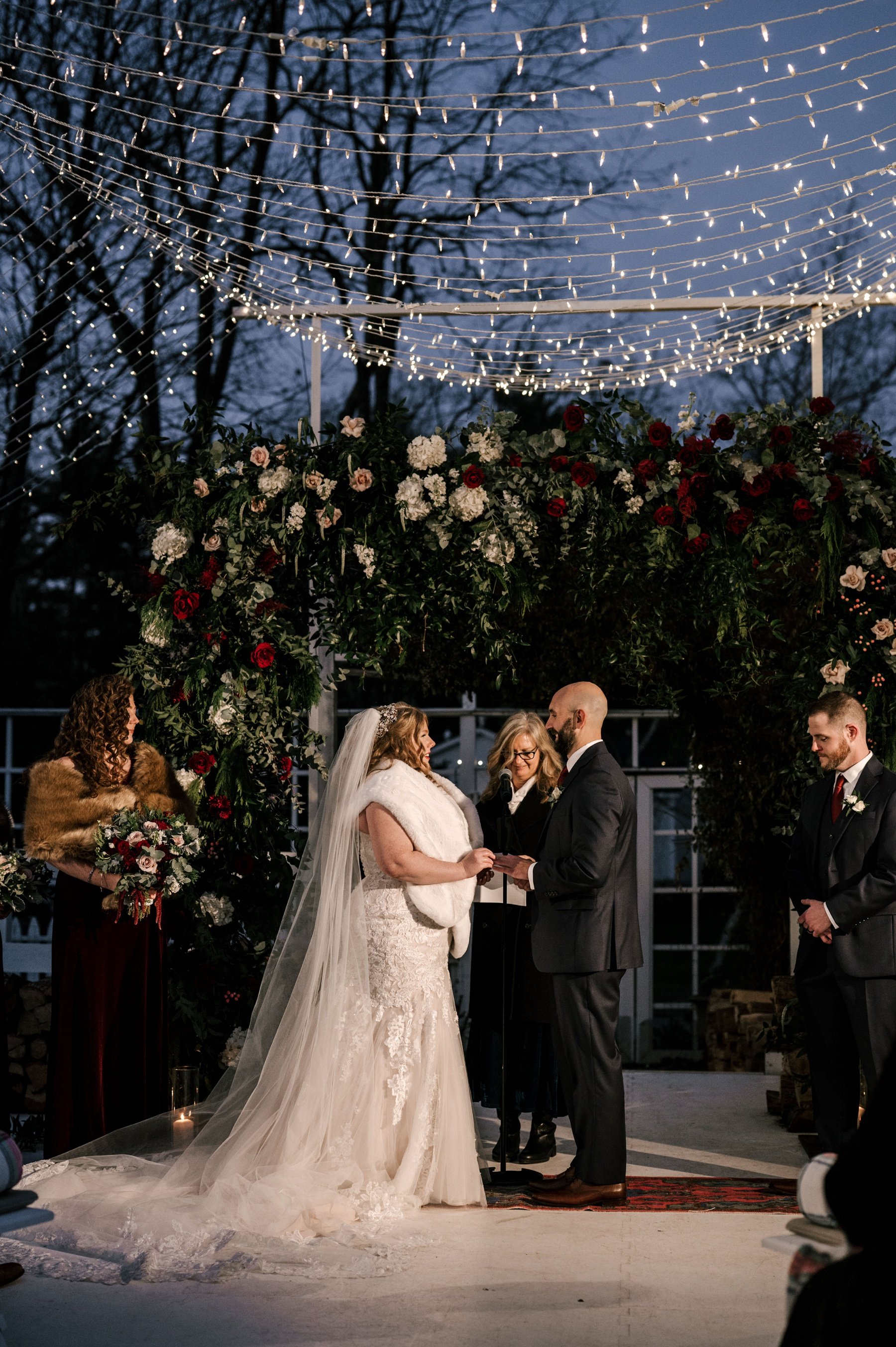 Sunset wedding ceremony on the ice rink at Cedar Lakes Estate