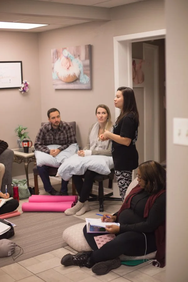 Tania Nuezca, IBCLC and The Bradley Method childbirth educator teaching a group course about labor, natural birth, and techniques to assist in birth.
