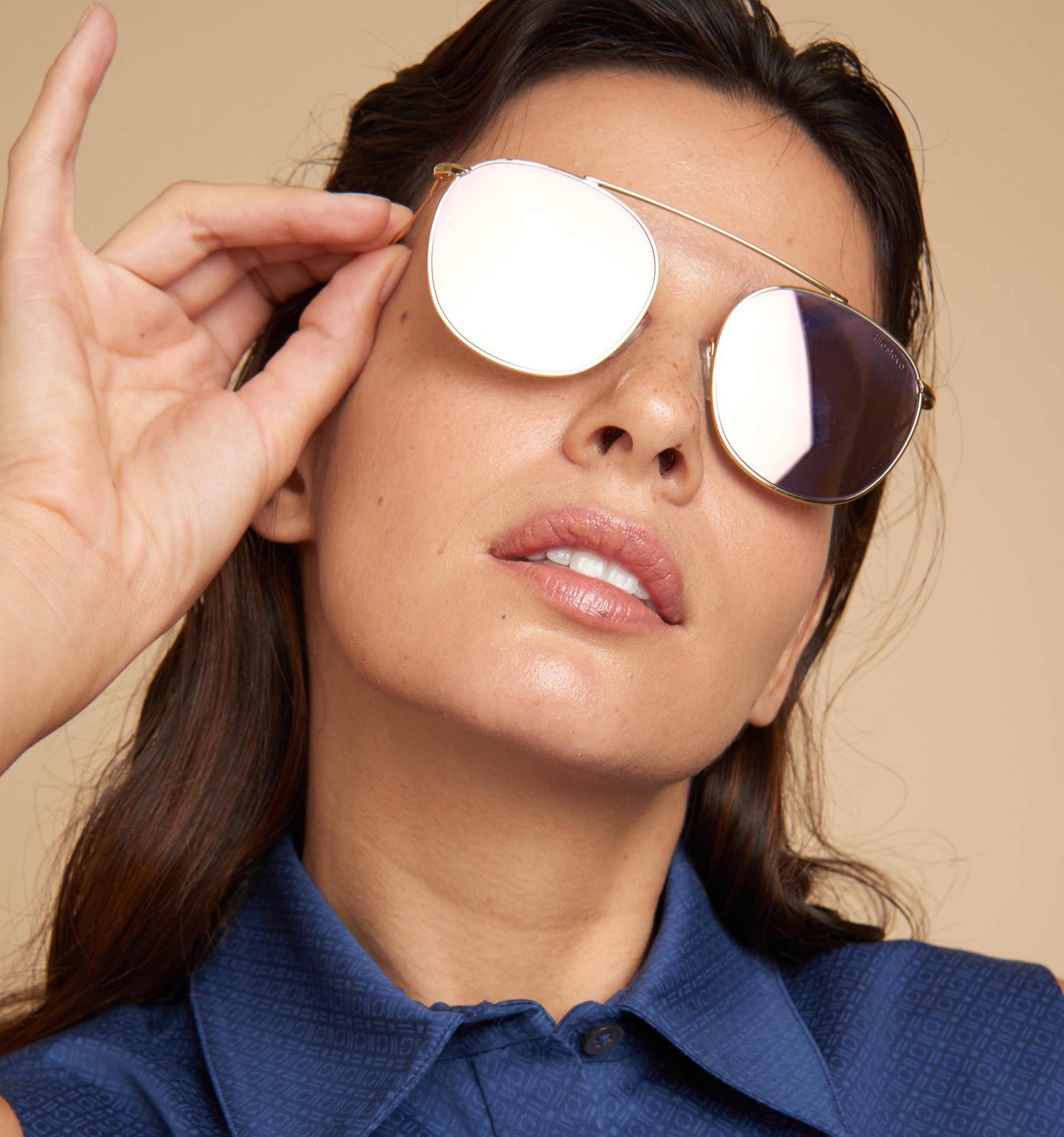 Headshot of Woman Wearing Sunglasses