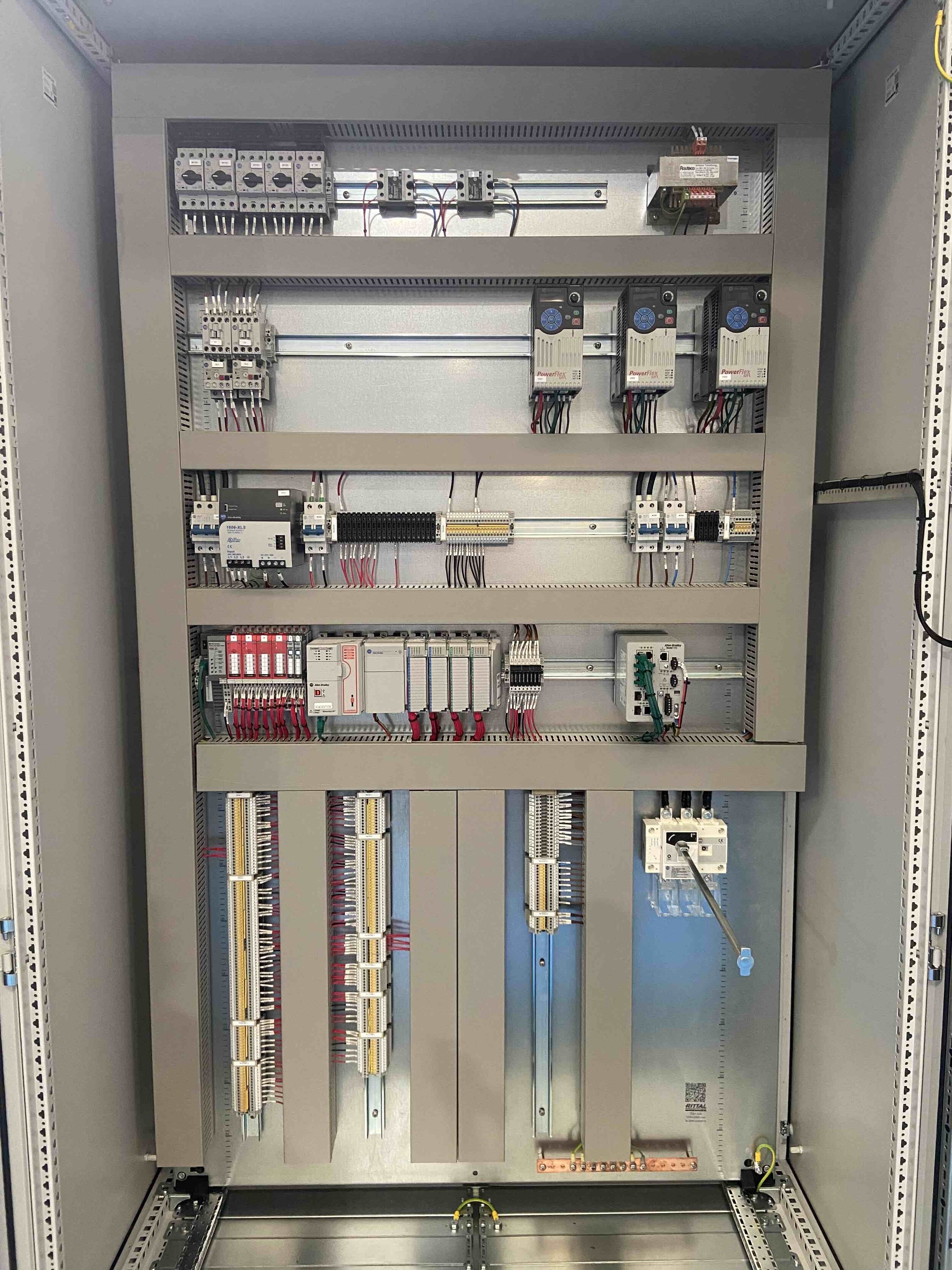 A number of circuit boards neatly linked inside a metal frame.