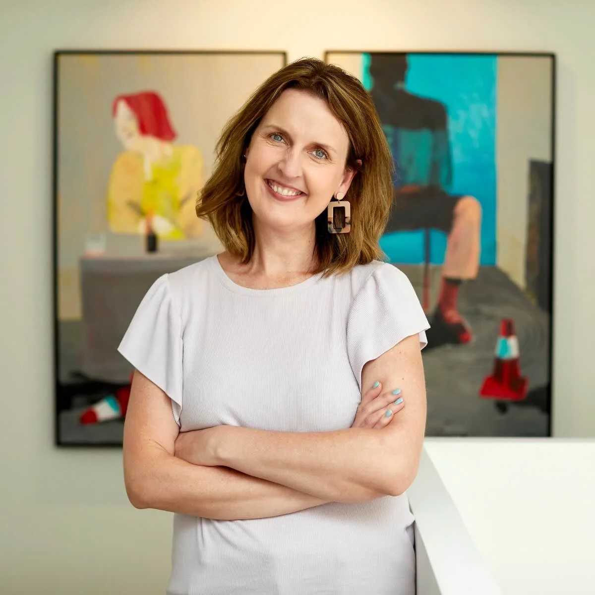 Georgie Bryant, certified coach for professional mums, smiling in natural light