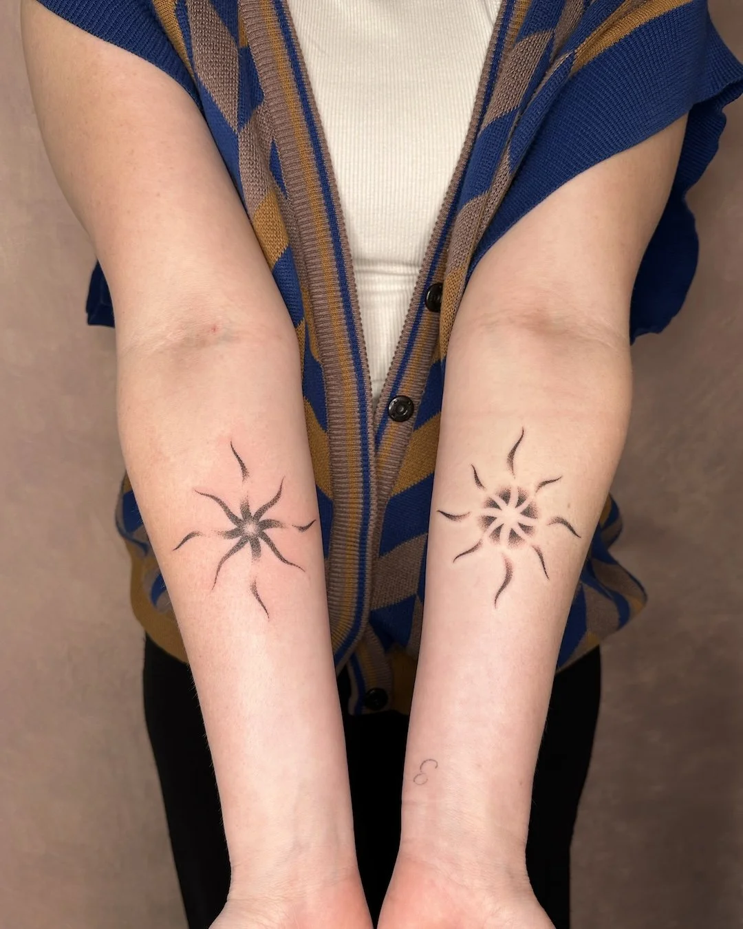 sun-pair-tattoo-forearm.jpg