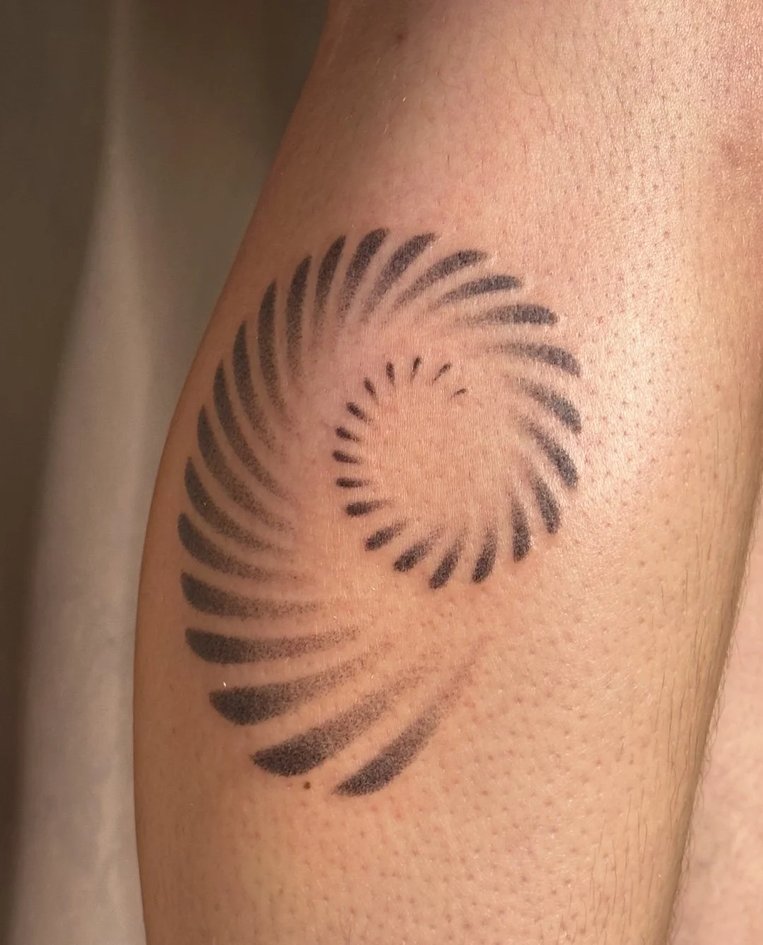 shell-spiral-tattoo-leg.jpeg