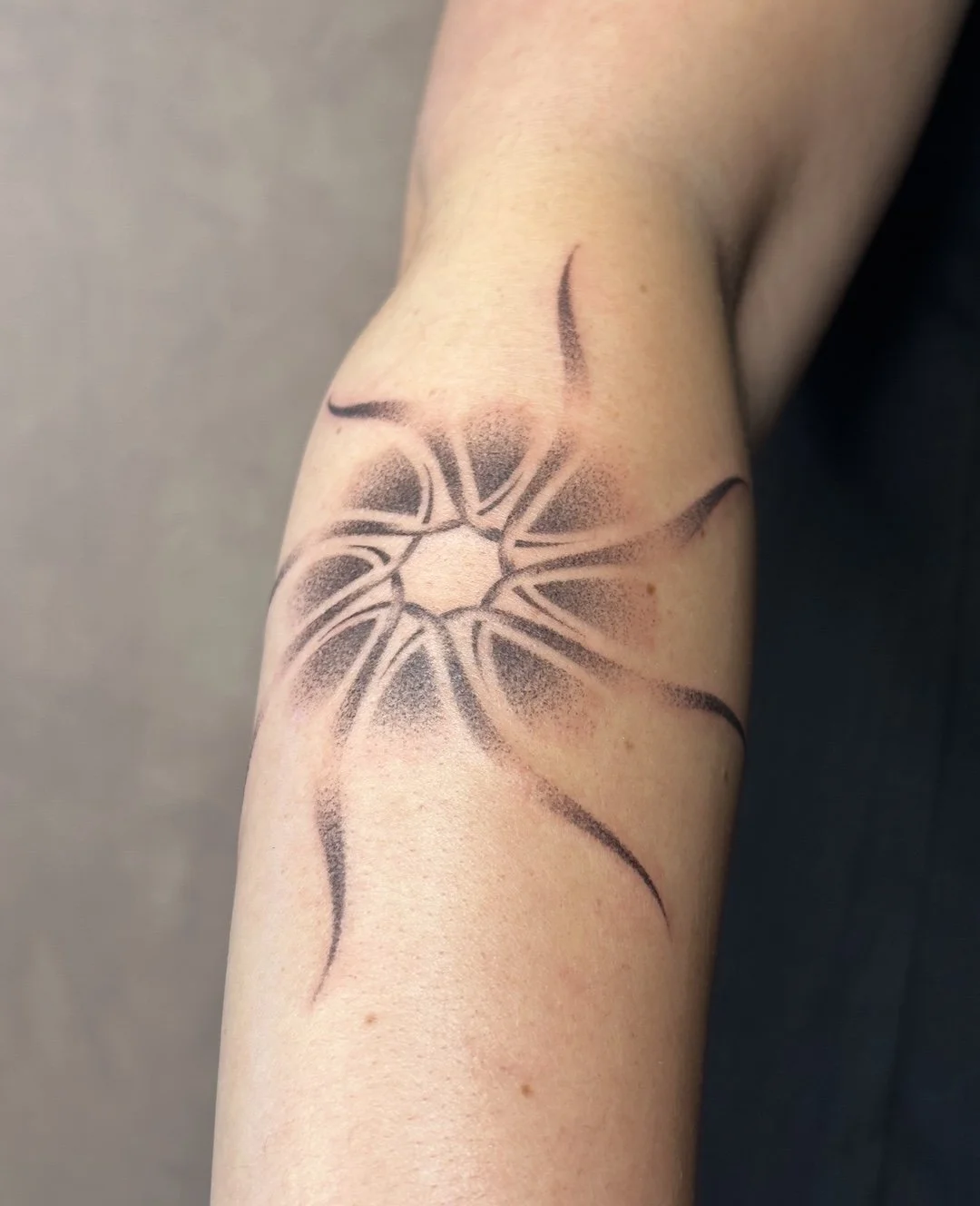 abstract-sun-tattoo-arm.jpeg