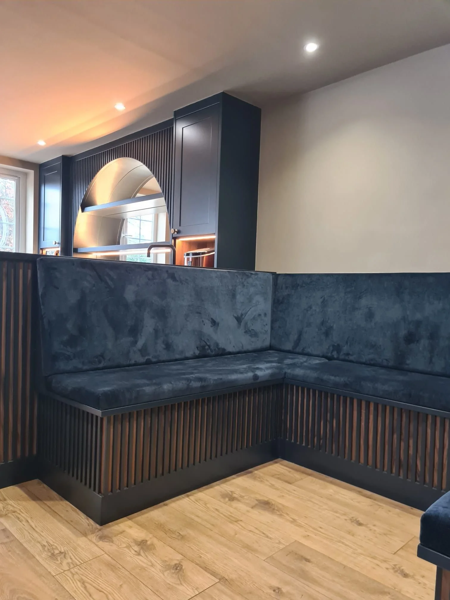 Bespoke banquet seating space created next to the bar.