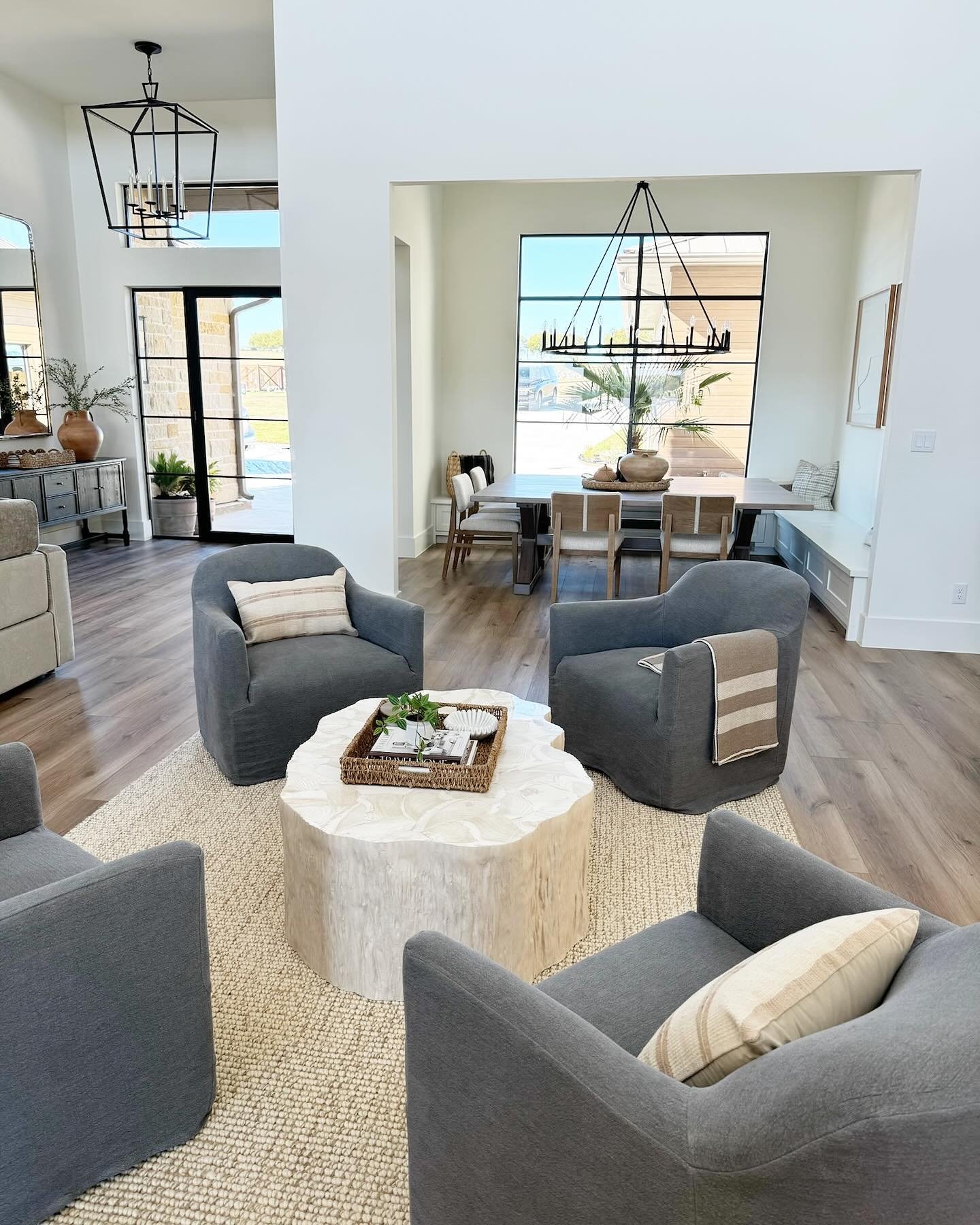 Hope you&rsquo;re staying warm and dry on this rainy Tuesday! Here&rsquo;s another look at one of our favorite living rooms in this open-concept lake house&mdash;beautifully designed, furnished, and styled by our team. #freshlystyledhome