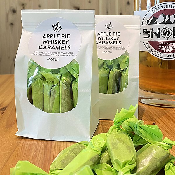 Bags of Apple Pie Moonshine Caramels on counter