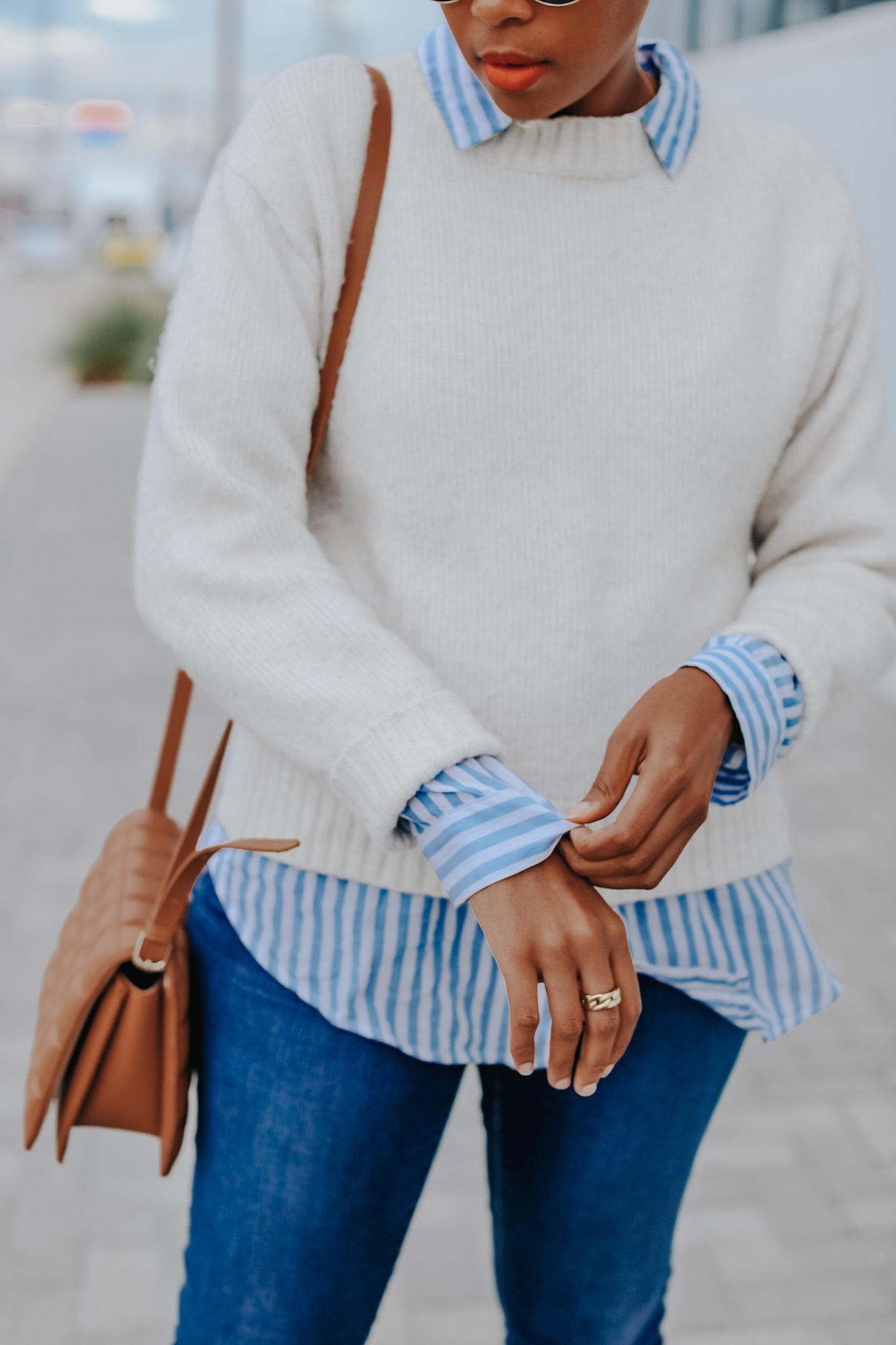 Mary's Little Way in A White Crewneck Sweater, a Blue and White Striped Boyfriend Shirt, Blue Jeans, and Tan Mules