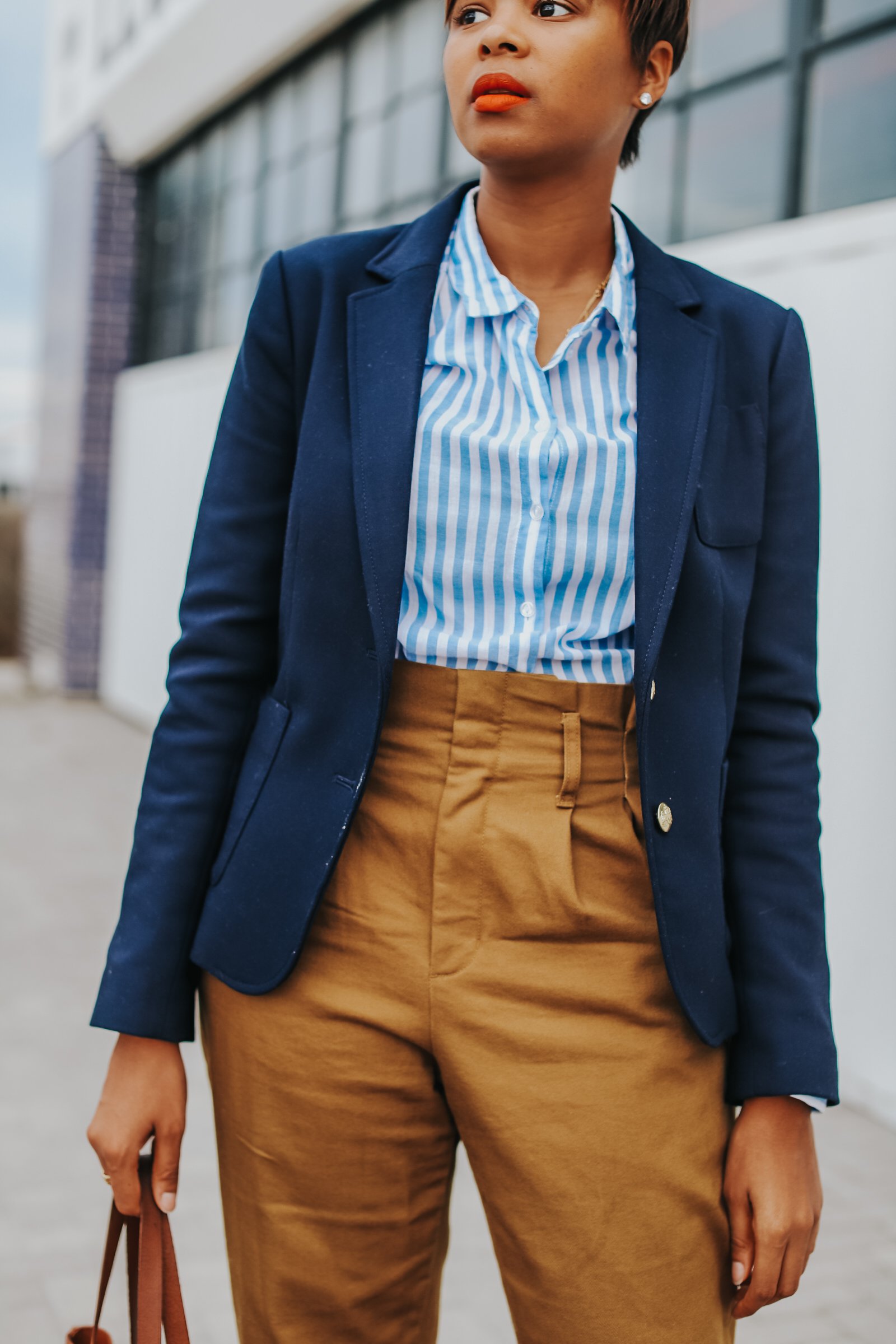 Mary's Little Way in A Navy Blazer, a Blue and White Striped Boyfriend Shirt, Mustard Yellow Paperboy Pants, and Brown Block Heels