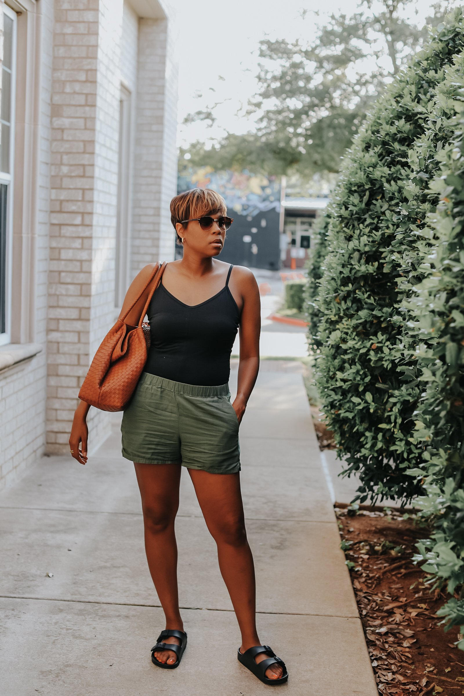 Mary's Little Way wearing Everlane's Cami Bodysuit, Everlane's Easy Shorts, Target's Birkenstock Dupes, and Able Clothing Selam Tote