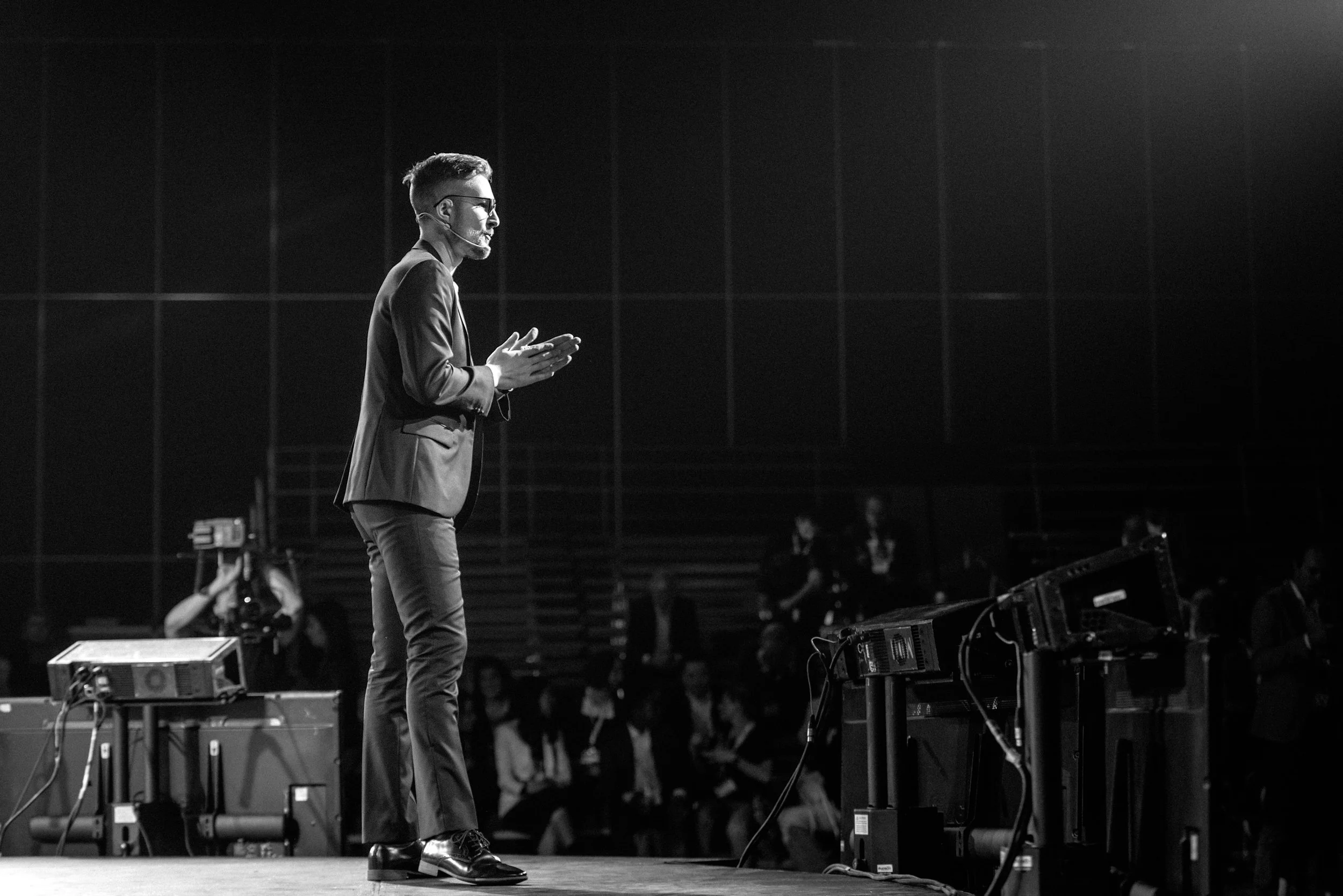 Nicholas Belliveau giving a keynote at a large conference