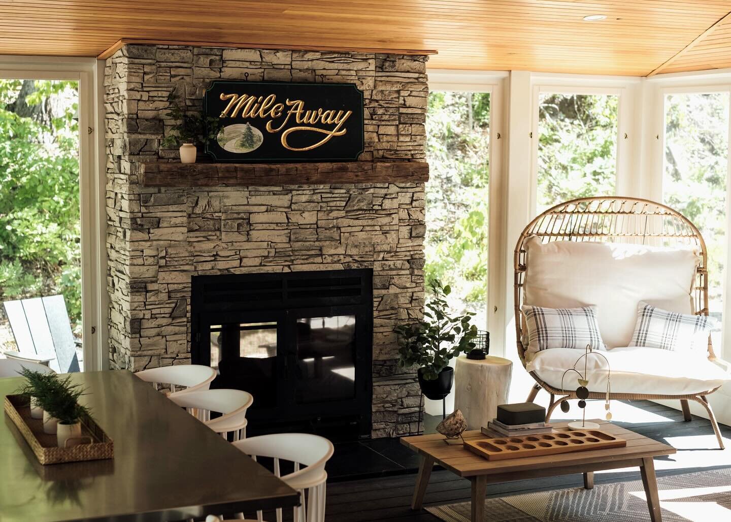 The sunroom at MileAway offers the most beautiful natural light from early morning to late afternoon, and at night, the crackling fire from our indoor/outdoor fireplace creates the coziest ambiance. This space, along with our hot tub patio, are the o