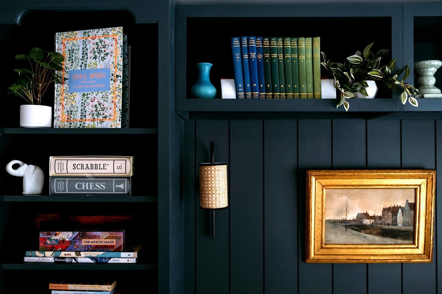 We created the MileAway Den &amp; Library combo with period details to make it feel like it had always been a feature of the home, with paneled walls, custom shelving, and the use of historic colors. The beautiful deep blue/green &ldquo;Amalfi&rdquo;