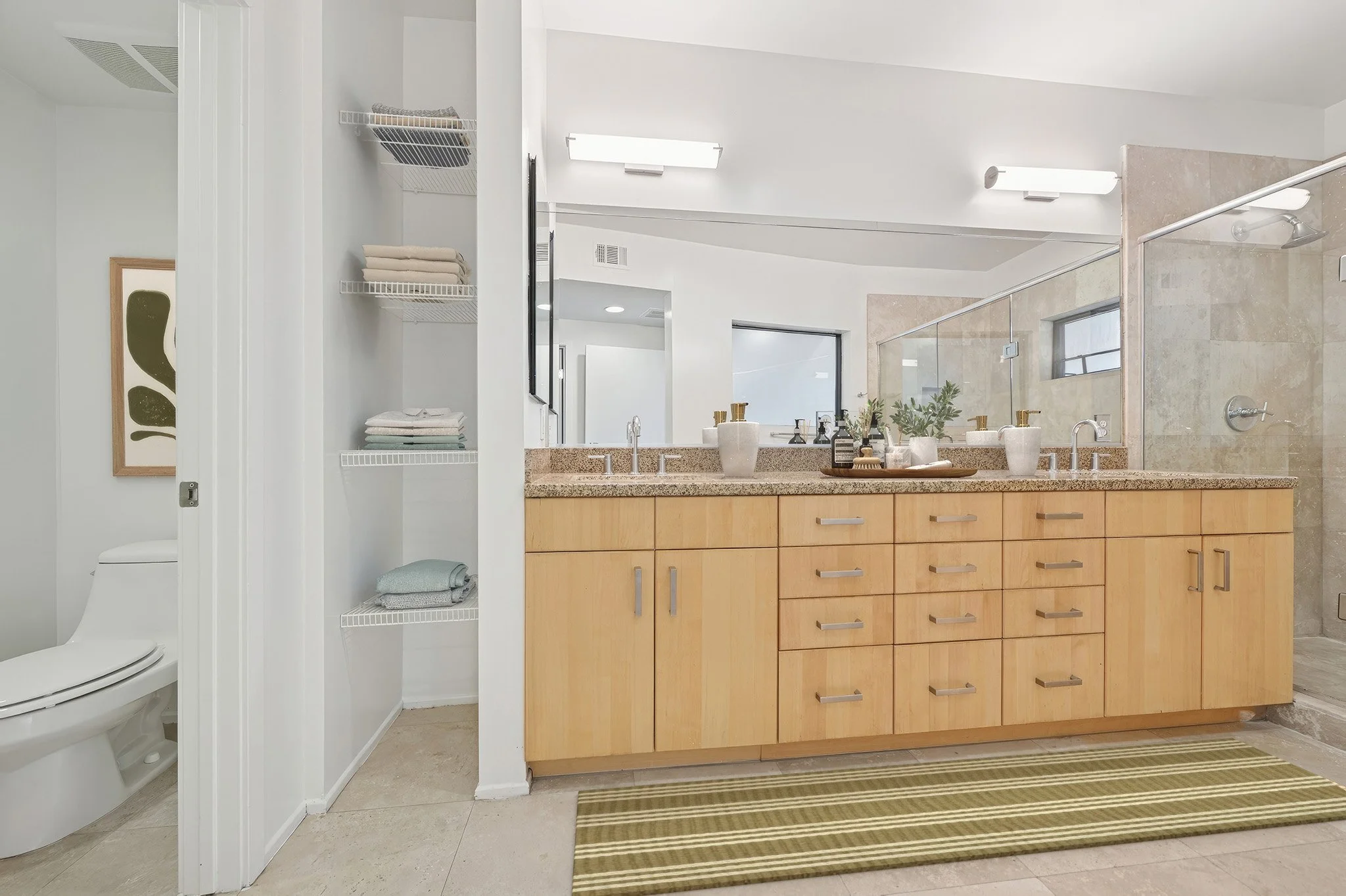 This is a photo of a two-bedroom apartment unit at M Sole. This image shows the large primary bathroom.