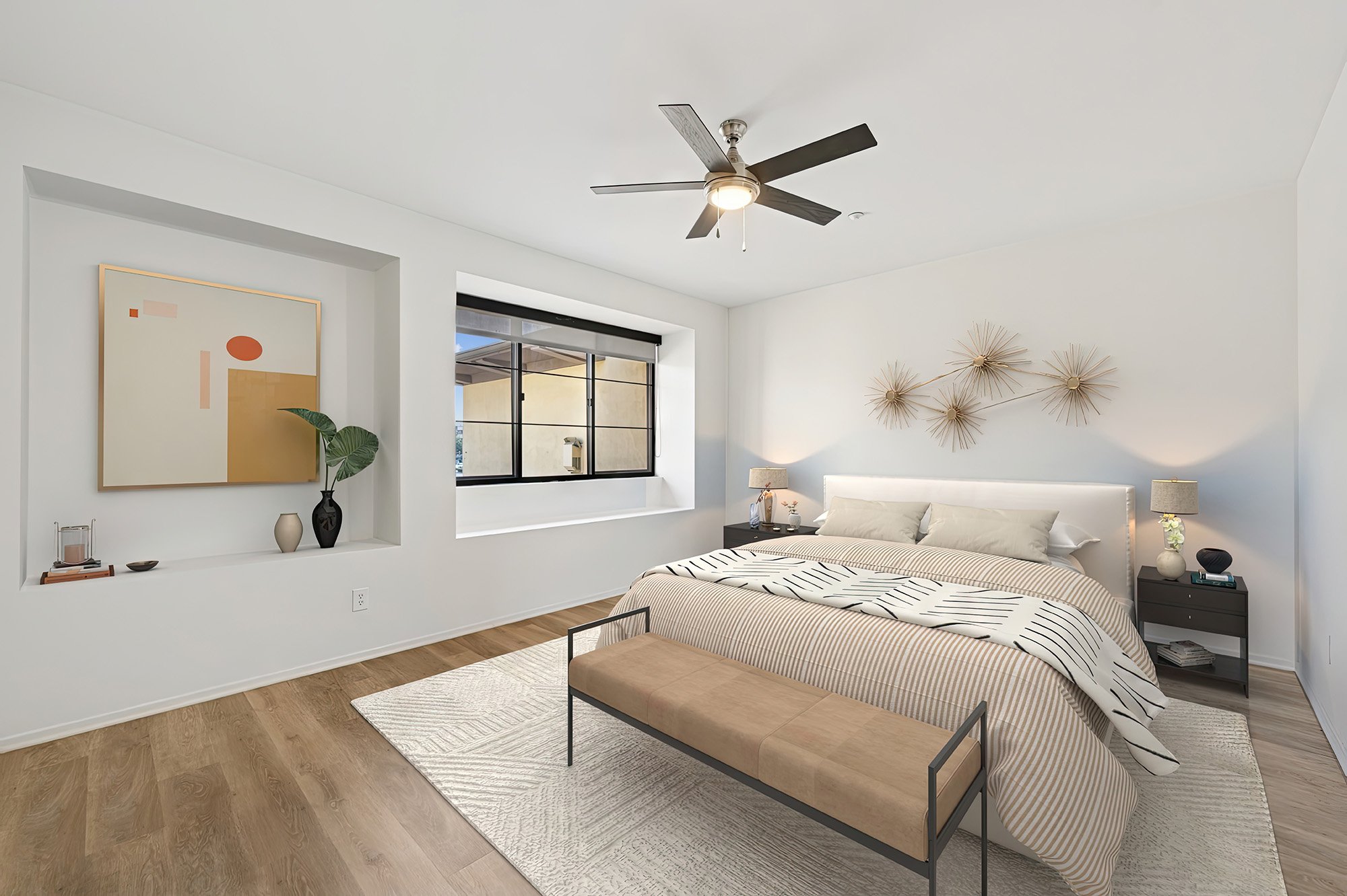 This is a photo of a two-bedroom apartment unit at M Sole. This image shows the cozy primary bedroom. 