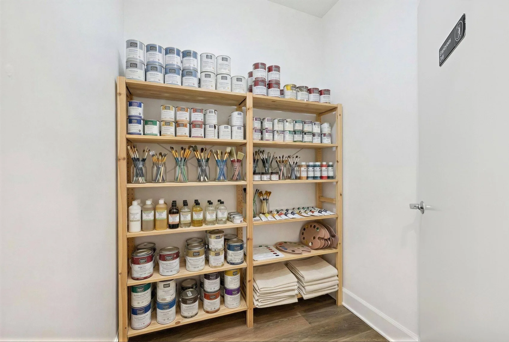 This is a photo of a two-bedroom apartment unit at M Sole. This image shows the downstairs workspace closet, perfect for extra storage. 