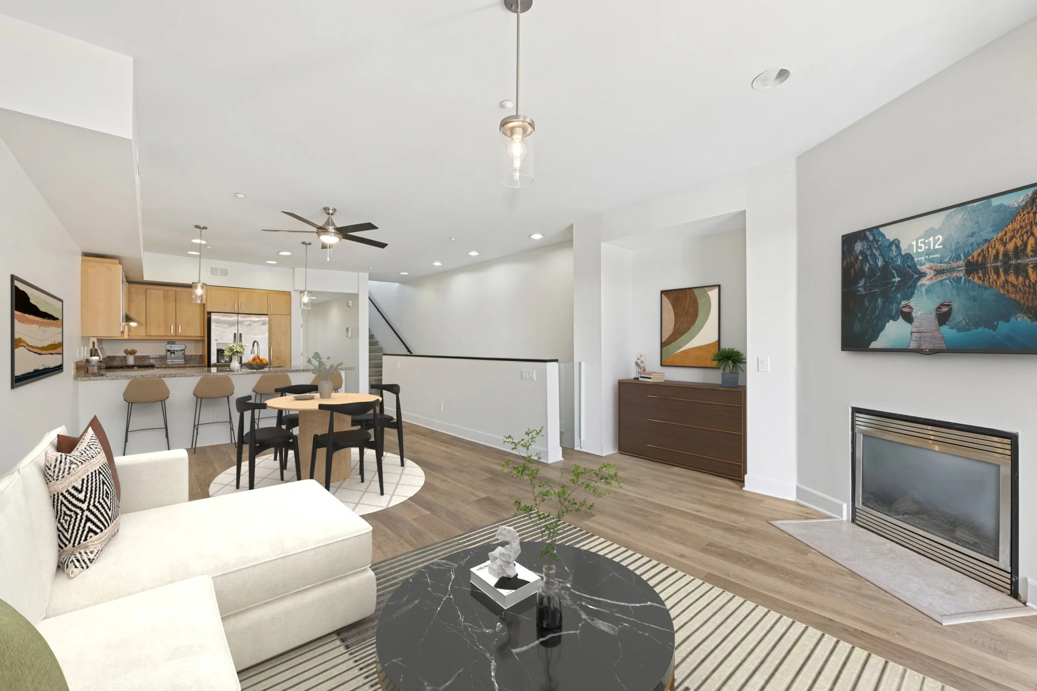 This is a photo of a two-bedroom apartment unit at M Sole. This image shows the living room, dining room & kitchen. 