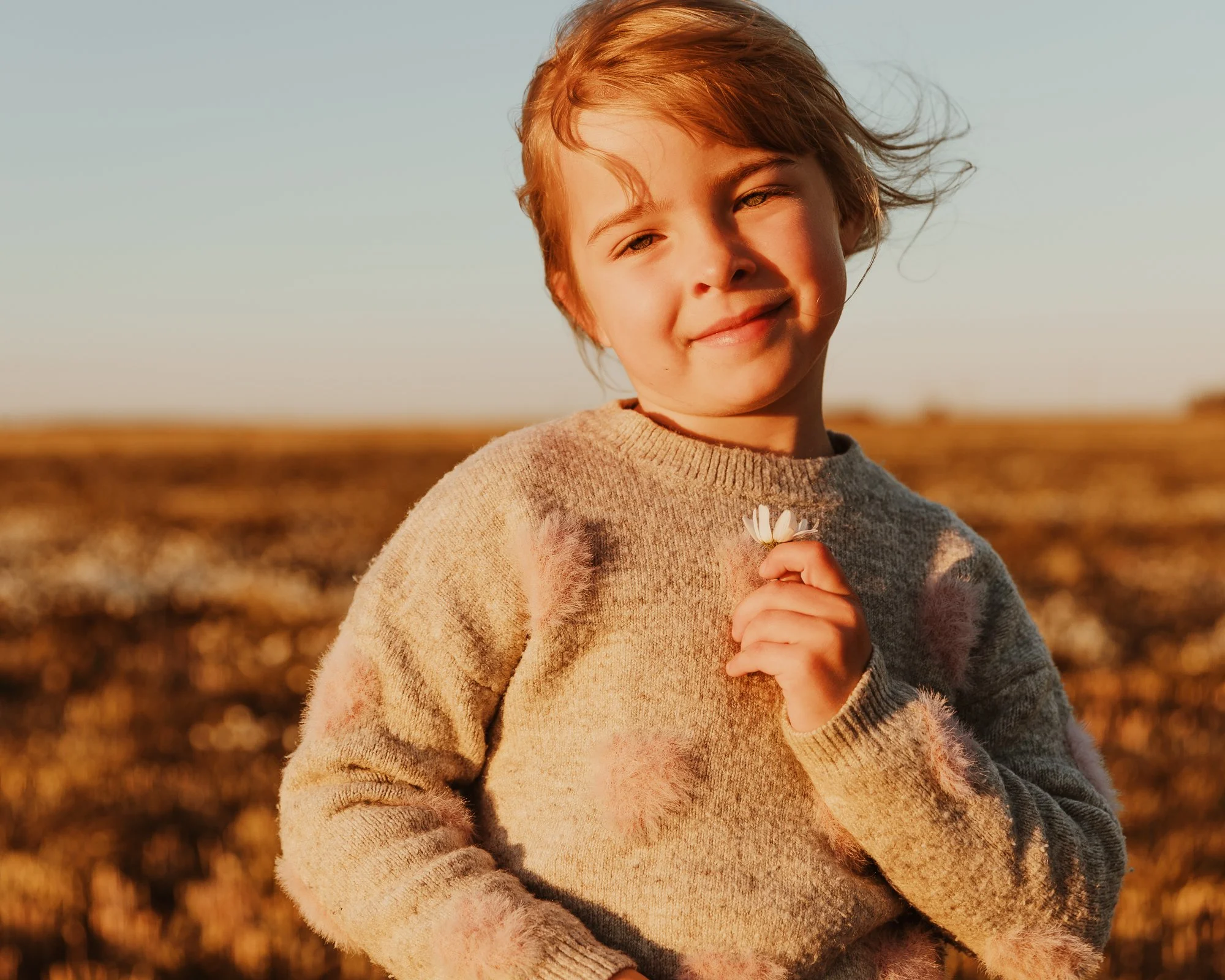 girl holding daisy.jpg