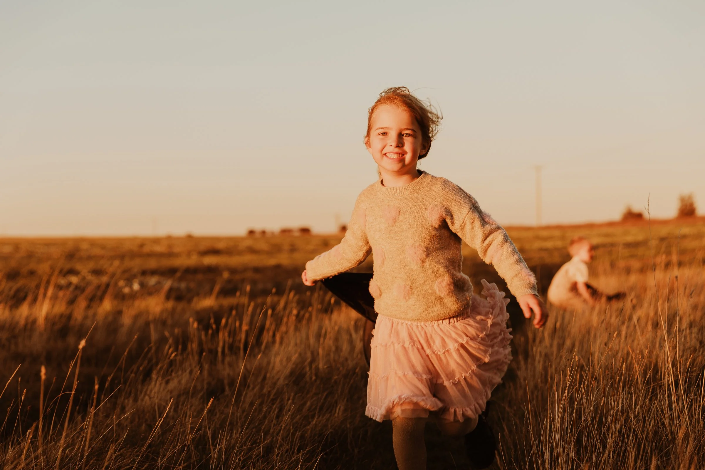 girl running in field.jpg