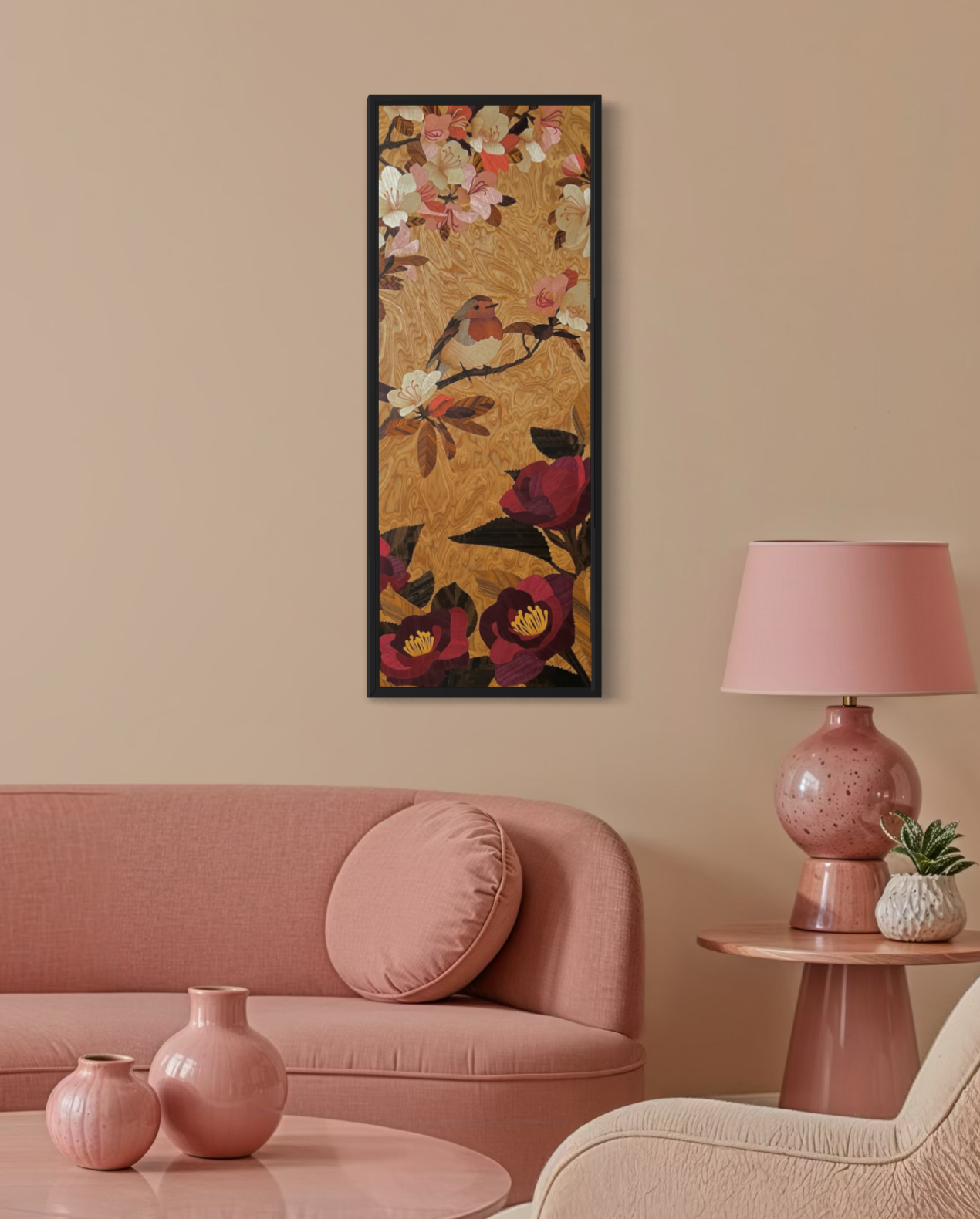 A pink living room with a pink sofa, pink vases on a table, a pink table lamp, and a framed marquetry artwork of a robin on a branch with flowers on the wall.