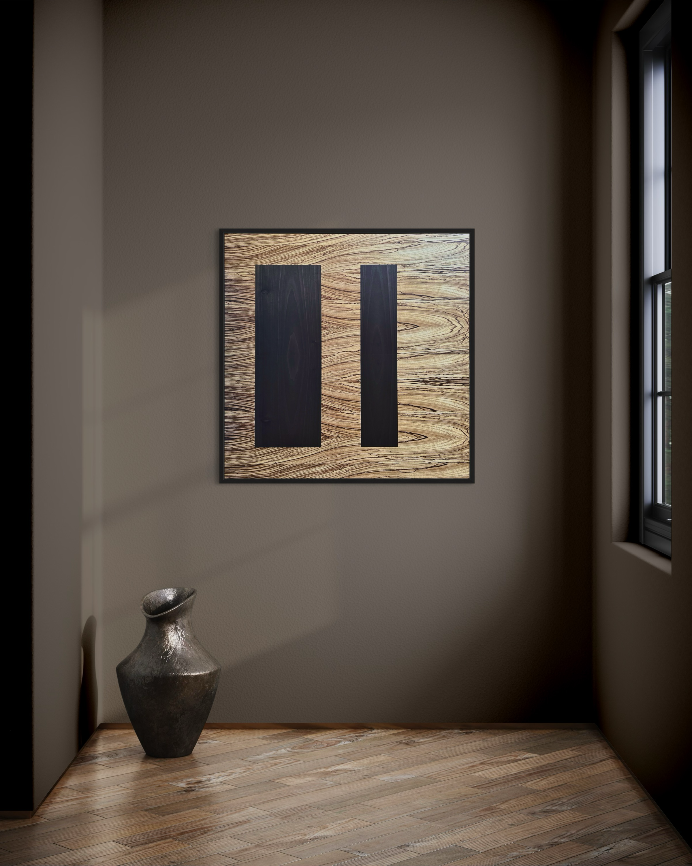 Modern minimalist interior with a wooden floor, a textured gray vase, and a framed abstract art piece featuring natural wood and dark panels on a brown wall.