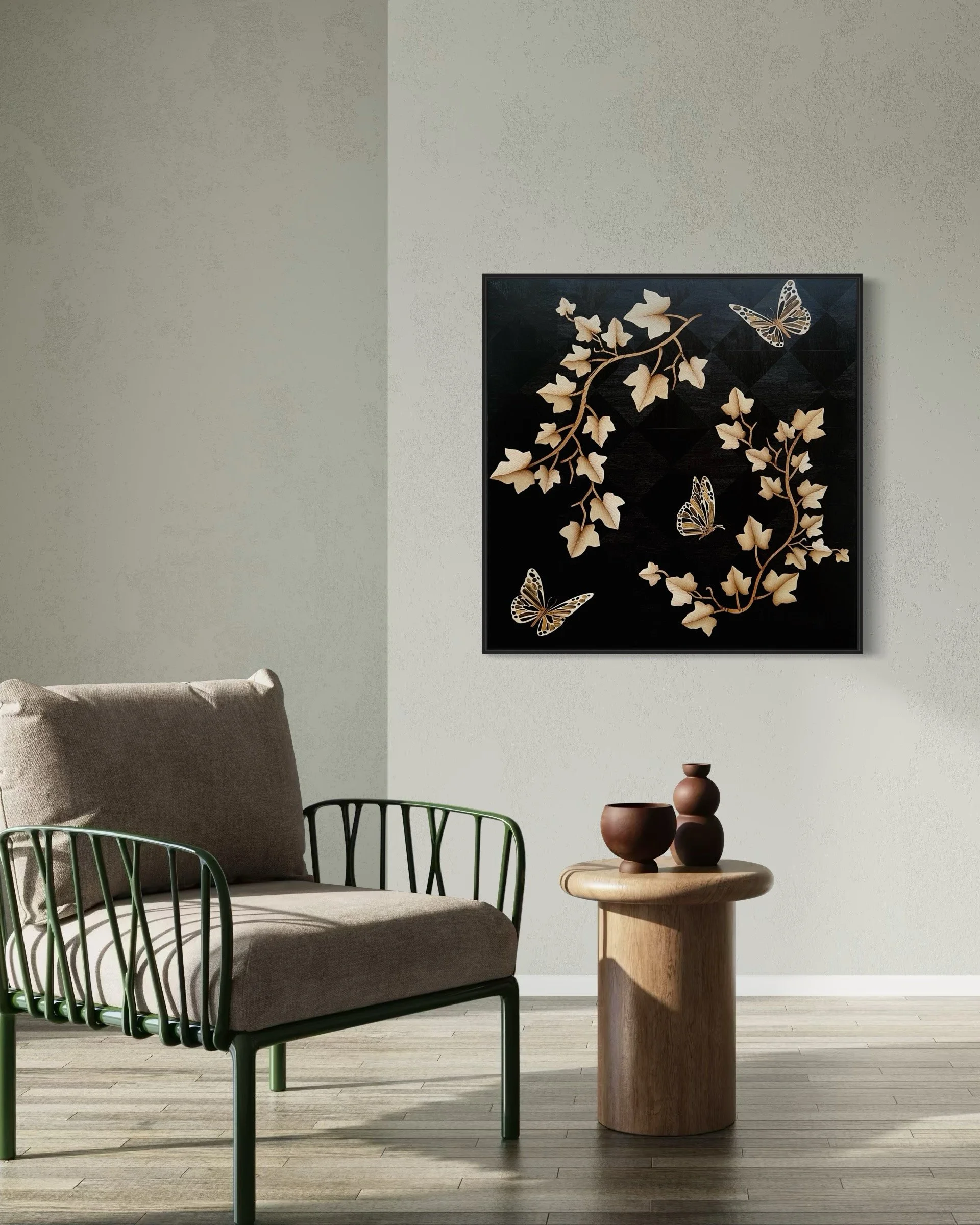 Minimalist living space with a beige chair, a wooden side table, and marquetry wall art featuring leaves and butterflies on a black background.