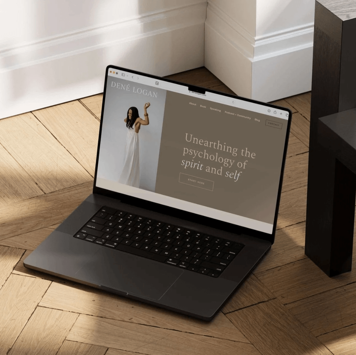 Website Mockup of Dene Logan's website a Depth Therapist with dark brown and cream and gray coloring