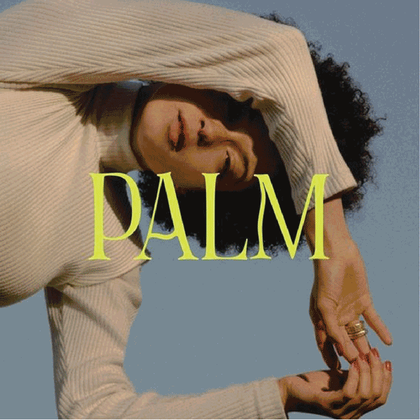 A woman with curly hair and closed eyes, in a beige ribbed long-sleeve top, posing with her arm raised and her hand near her face. The word "PALM" is overlaid in large yellow-green letters.