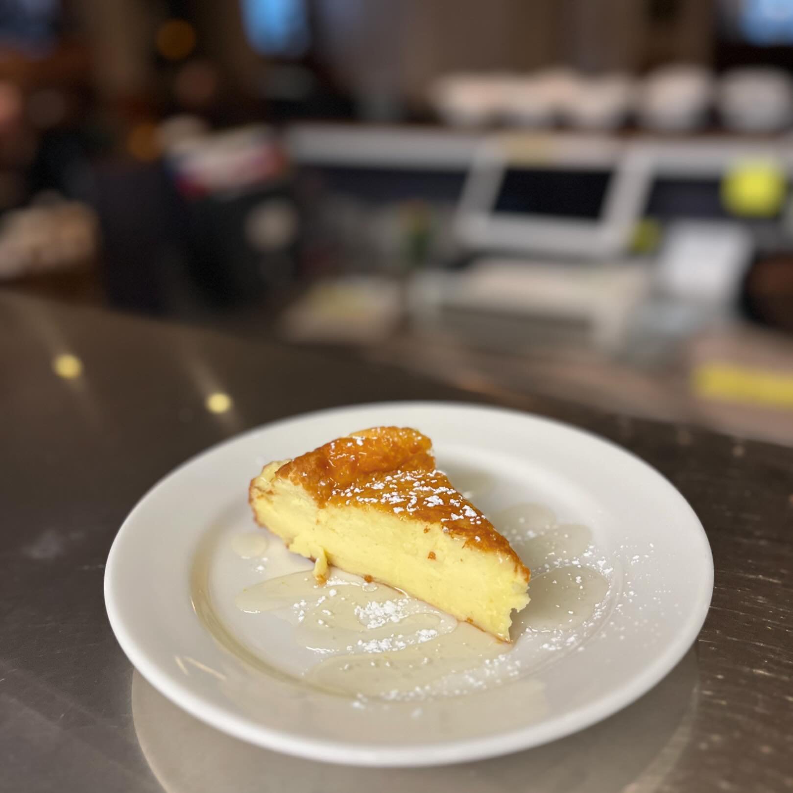 Basque Cheesecake ALL OF APRIL!!! Almond syrup reduction and a sprinkle of powdered sugar 👏🏼
