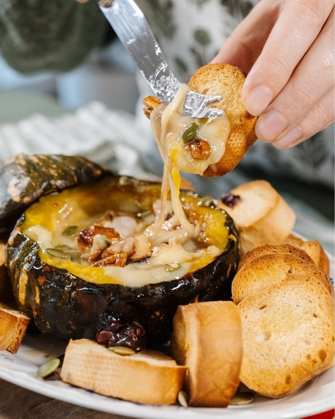 If you've never baked brie inside a roasted pumpkin, consider this your sign. This is an autumn favourite. Creamy, golden goodness topped with walnuts and pepitas. The kind of dish that earns you compliments without requiring a culinary degree.