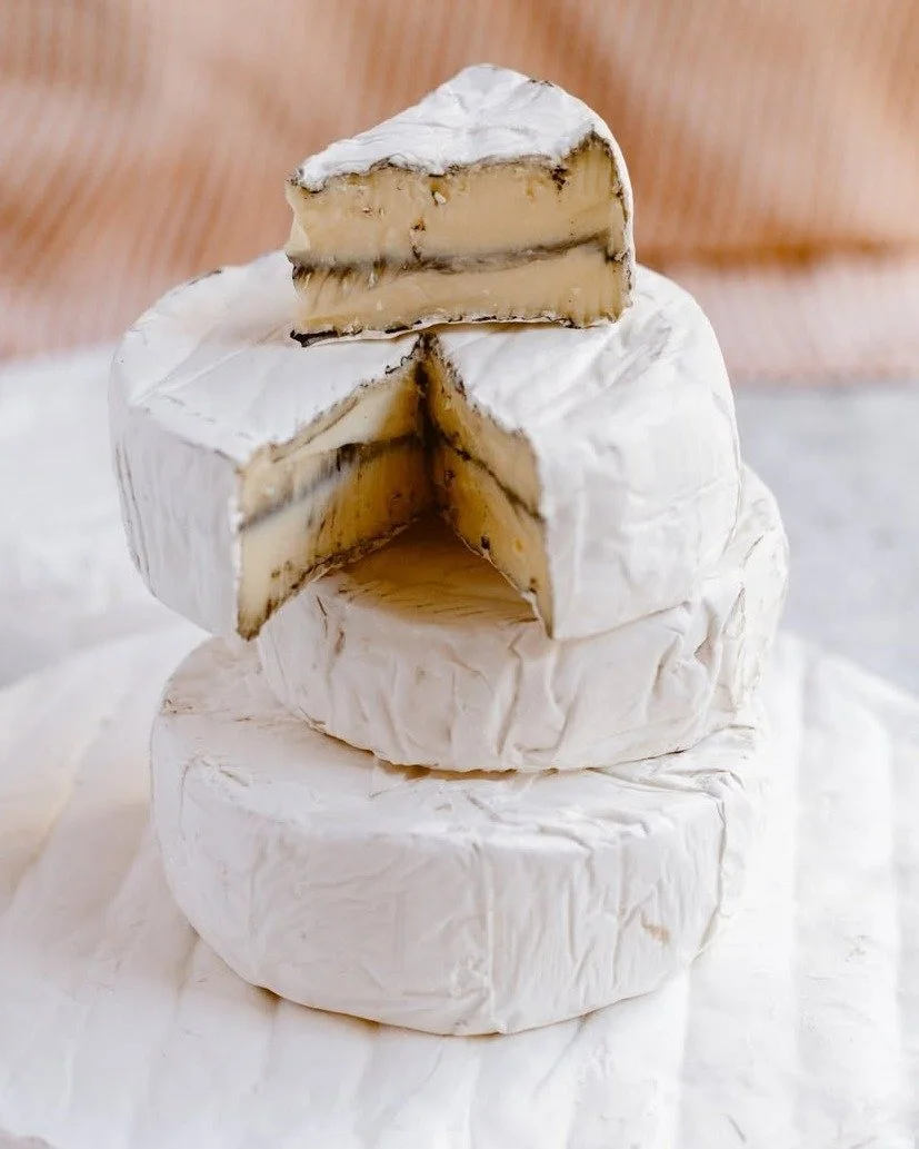 Beautiful on a board and even better on a cracker. Our Ash Brie is complex, earthy, and just a little smoky. 🧀