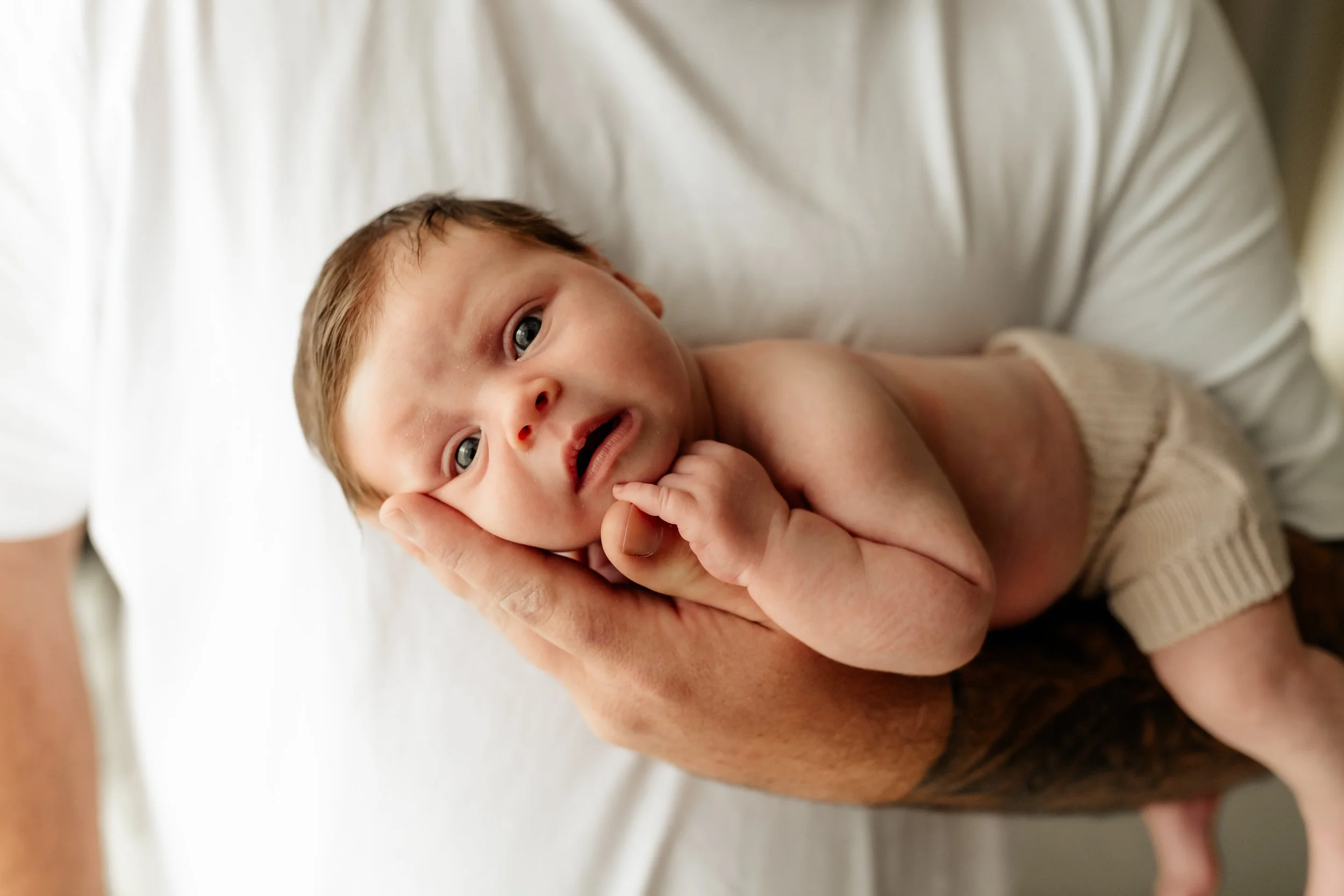 baby in Dads arms