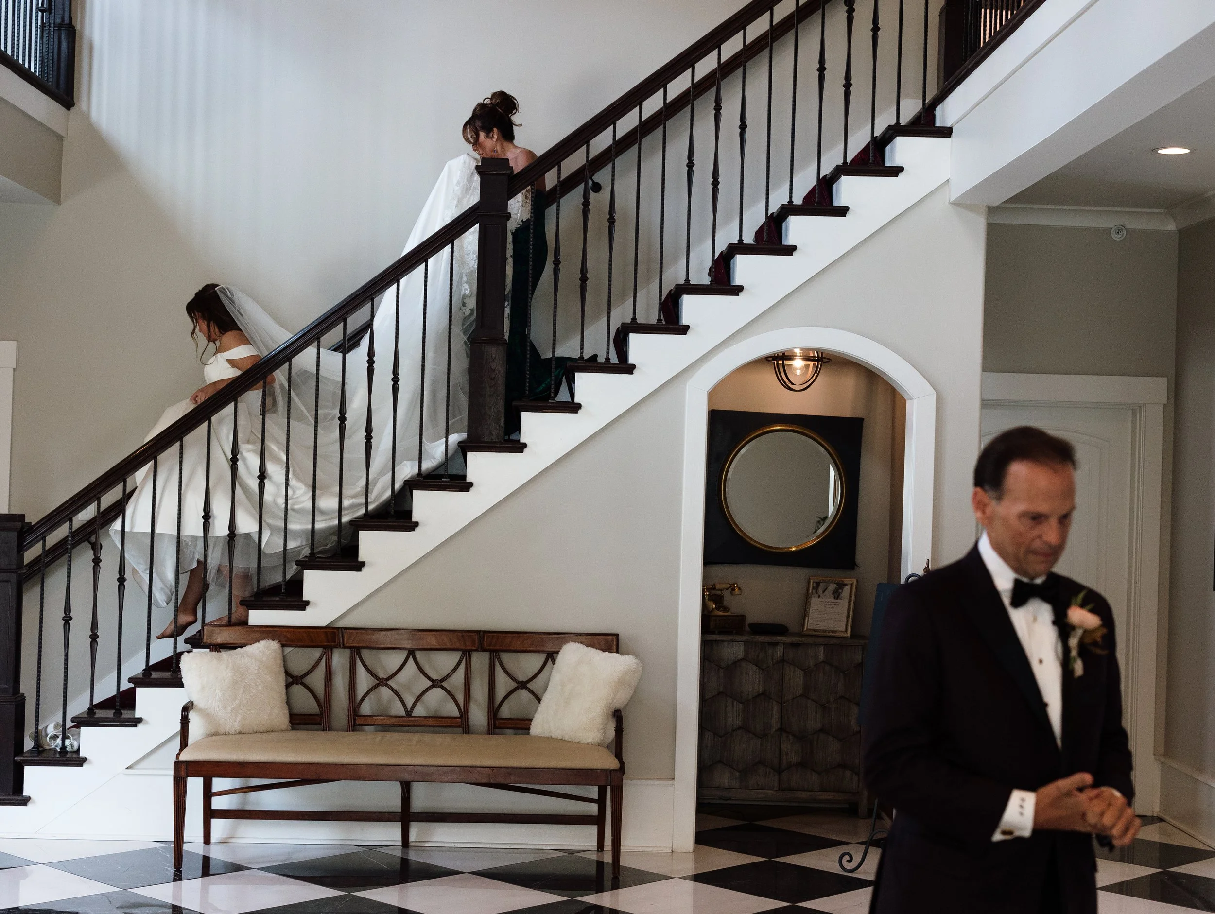 KY wedding photographer bride walking down staircase to groom during elegant indoor ceremony
