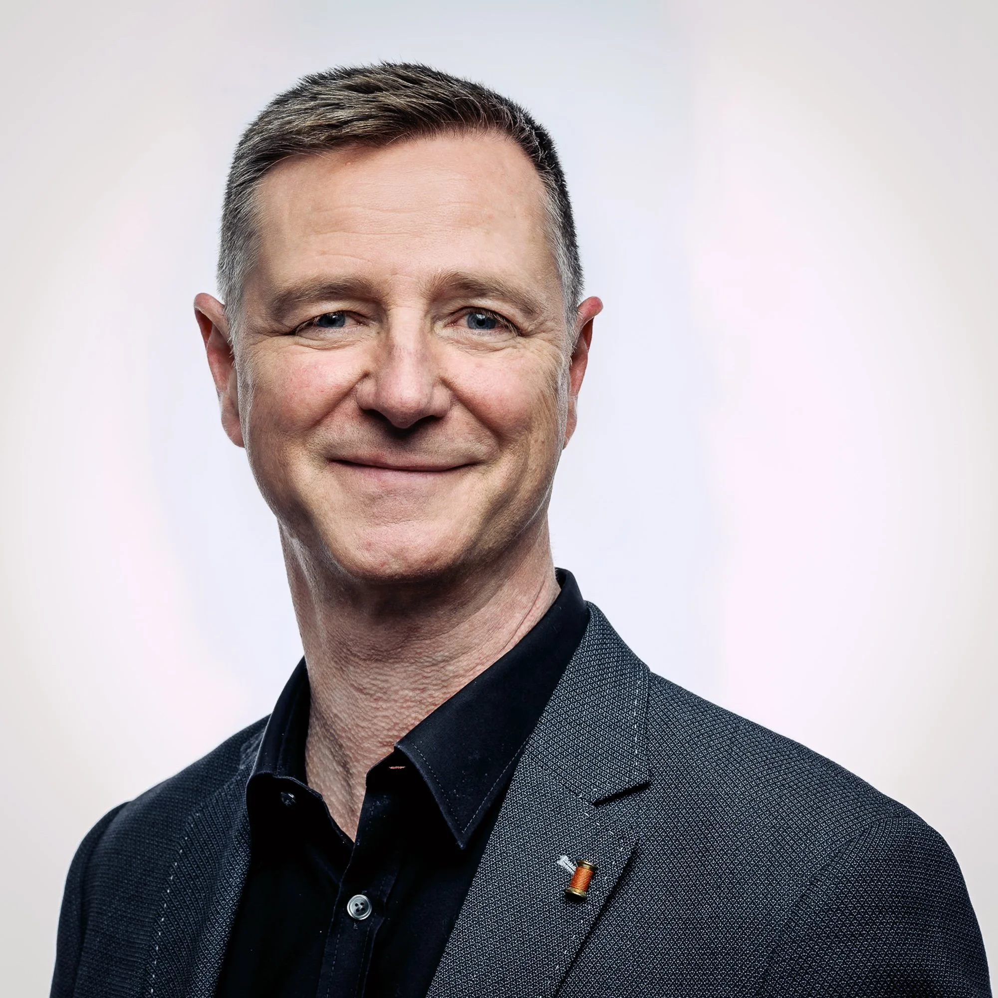 Environmental portrait of a global corporate leader photographed on location, conveying experience, credibility and trust.