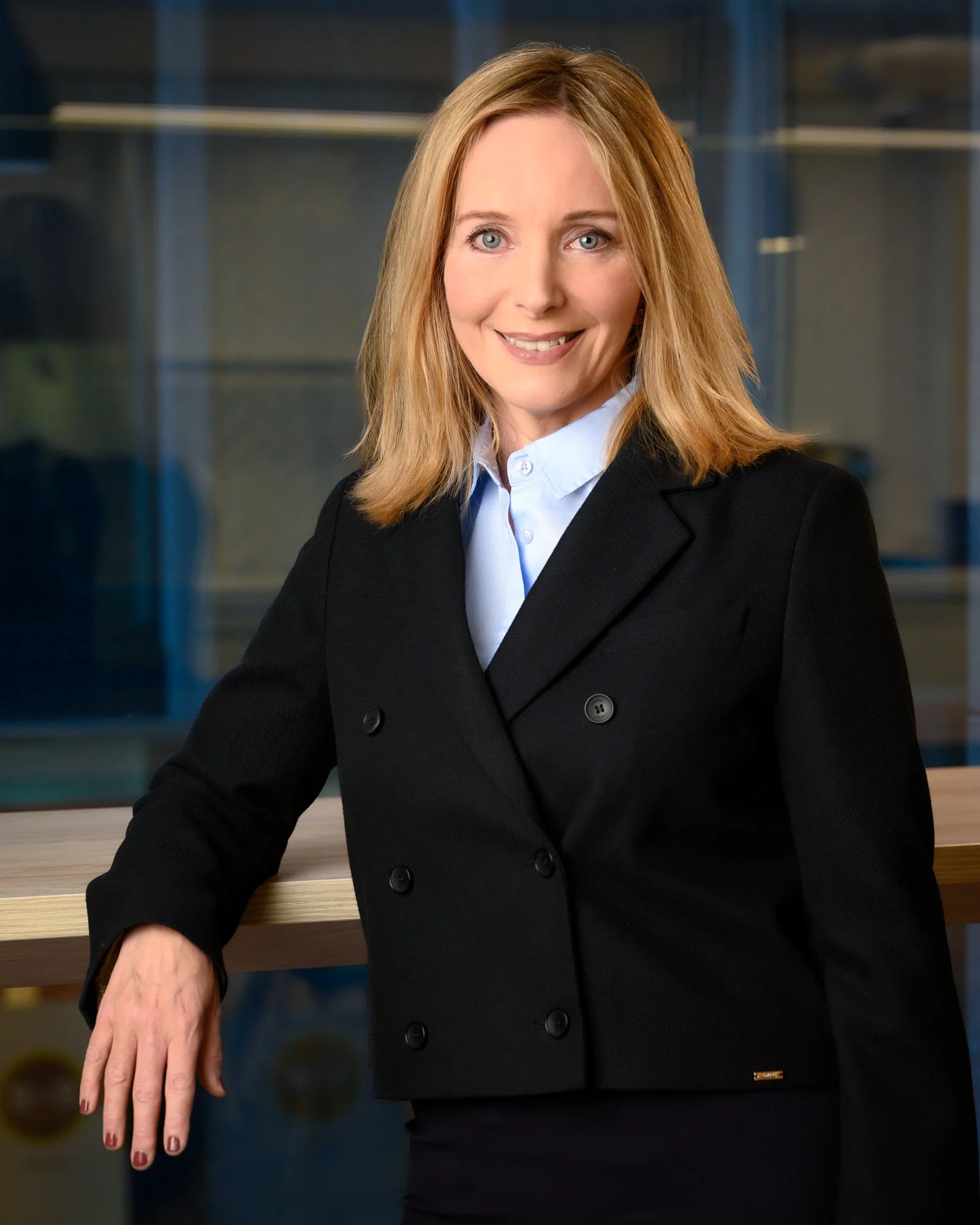 Business portrait of a senior executive photographed on location, conveying authority, strategic clarity and leadership presence.