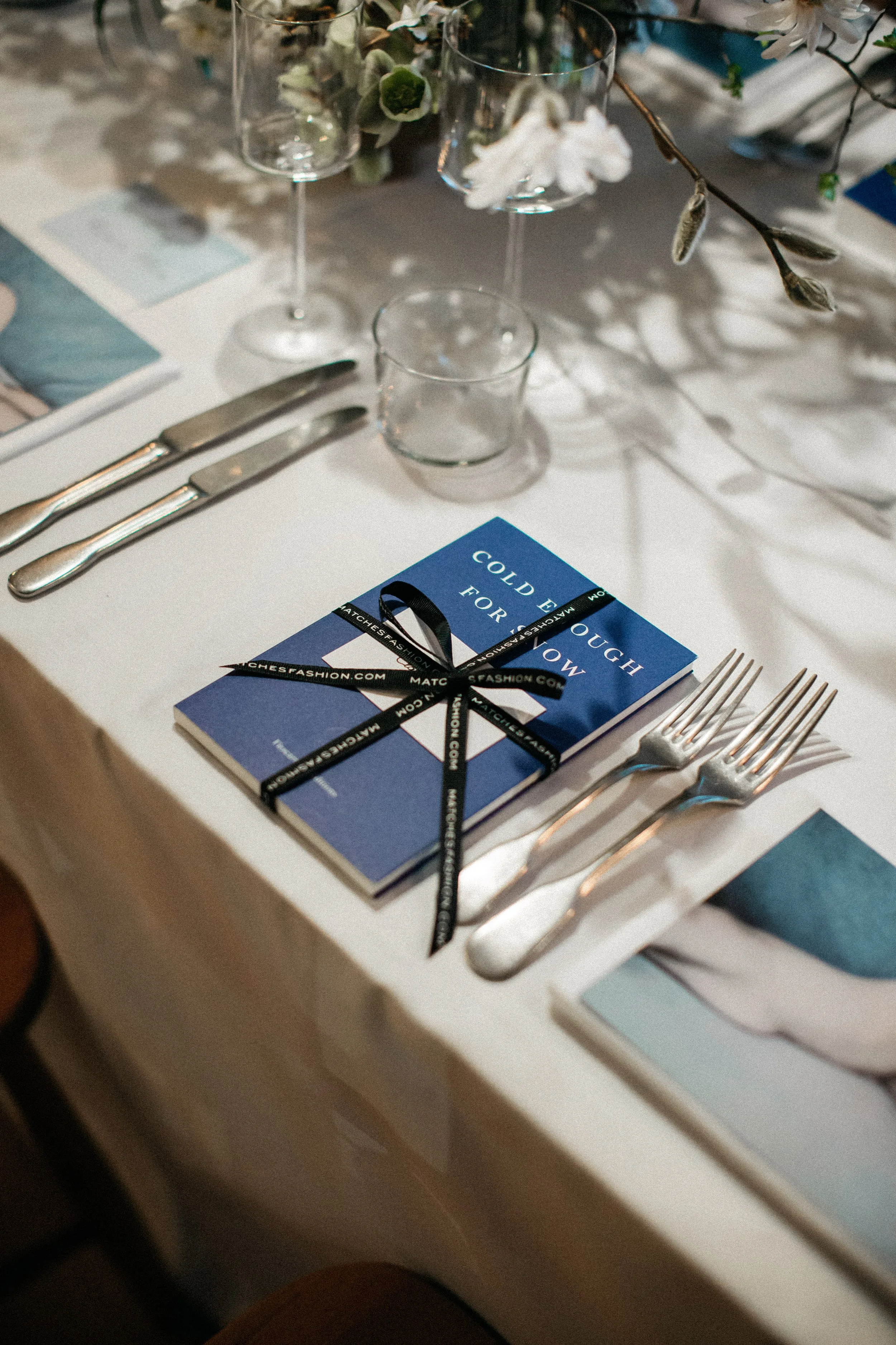 Table setting with book and cutlery