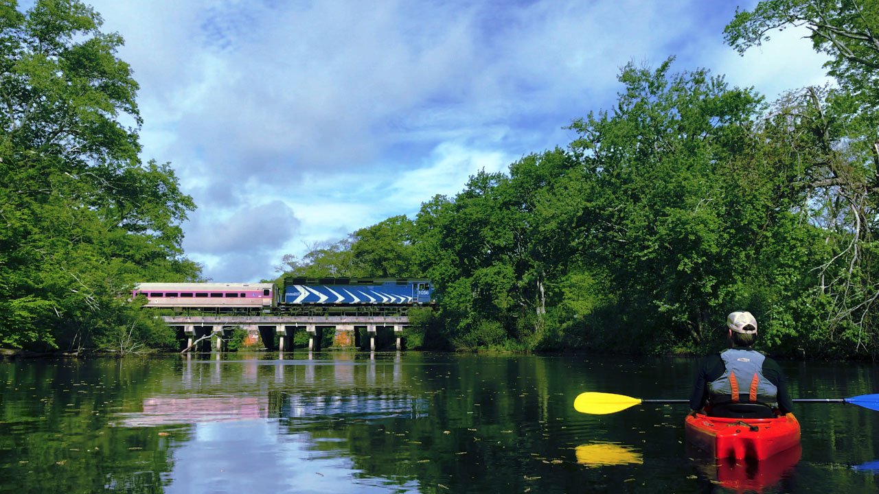 Train Crossing the River with Paddler.jpg