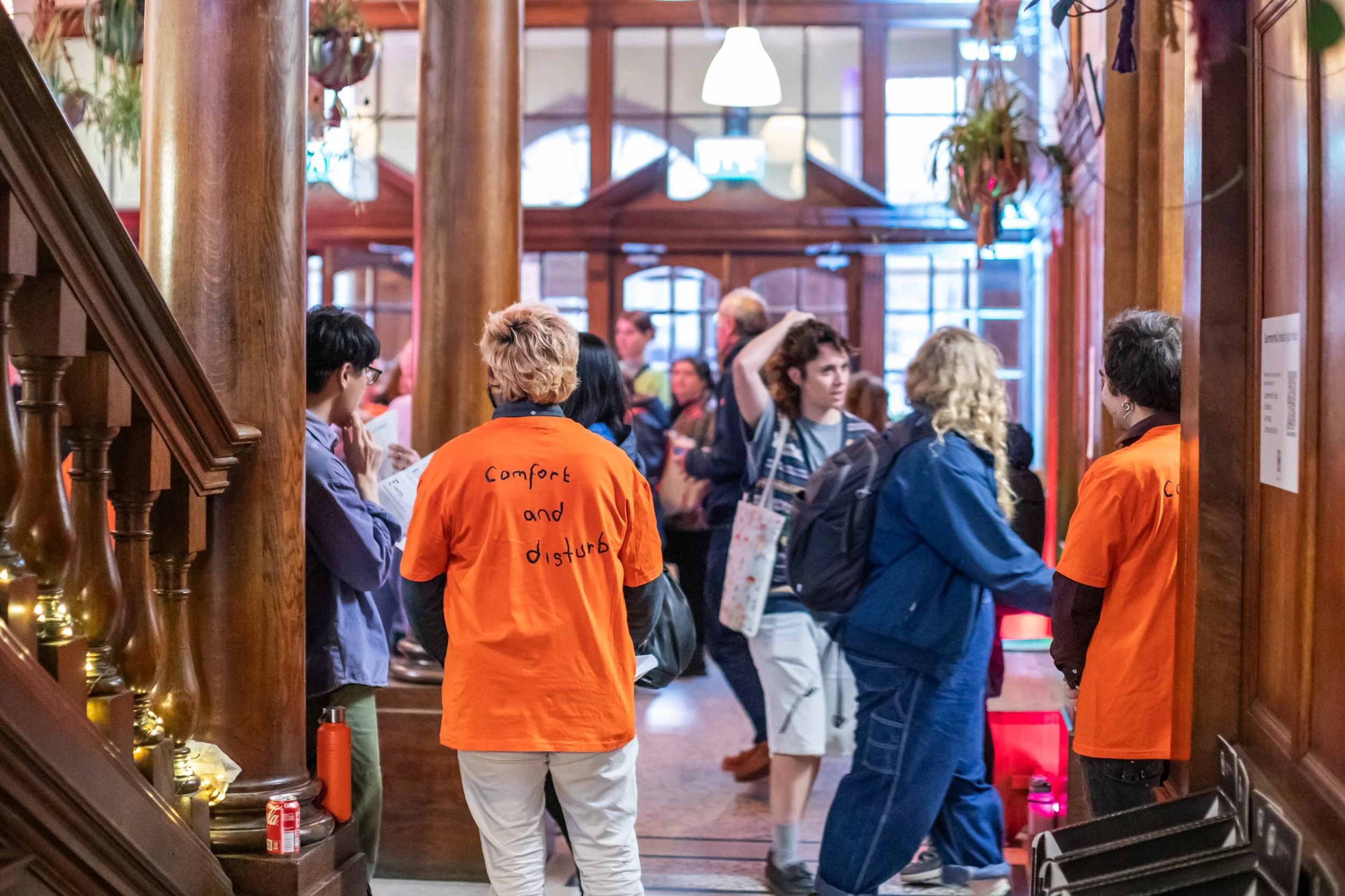 Visitors and team members standing welcoming people into the Summerhall foyer during the 2025 Launch event.