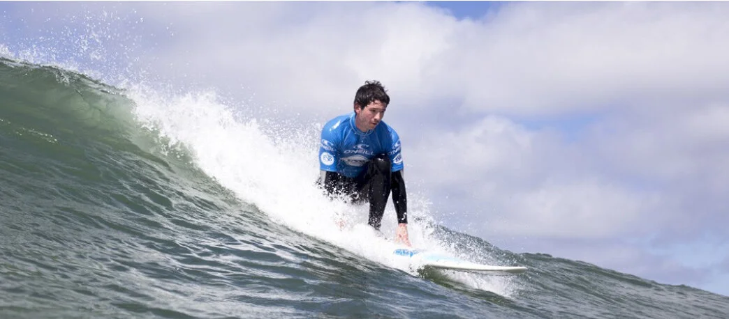 A surfer riding a green wave at Plouharnel, on the Quiberon Peninsula