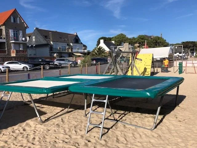 Trampolines at the Neptune Beach Club on the sand of Carnac’s Grande Plage